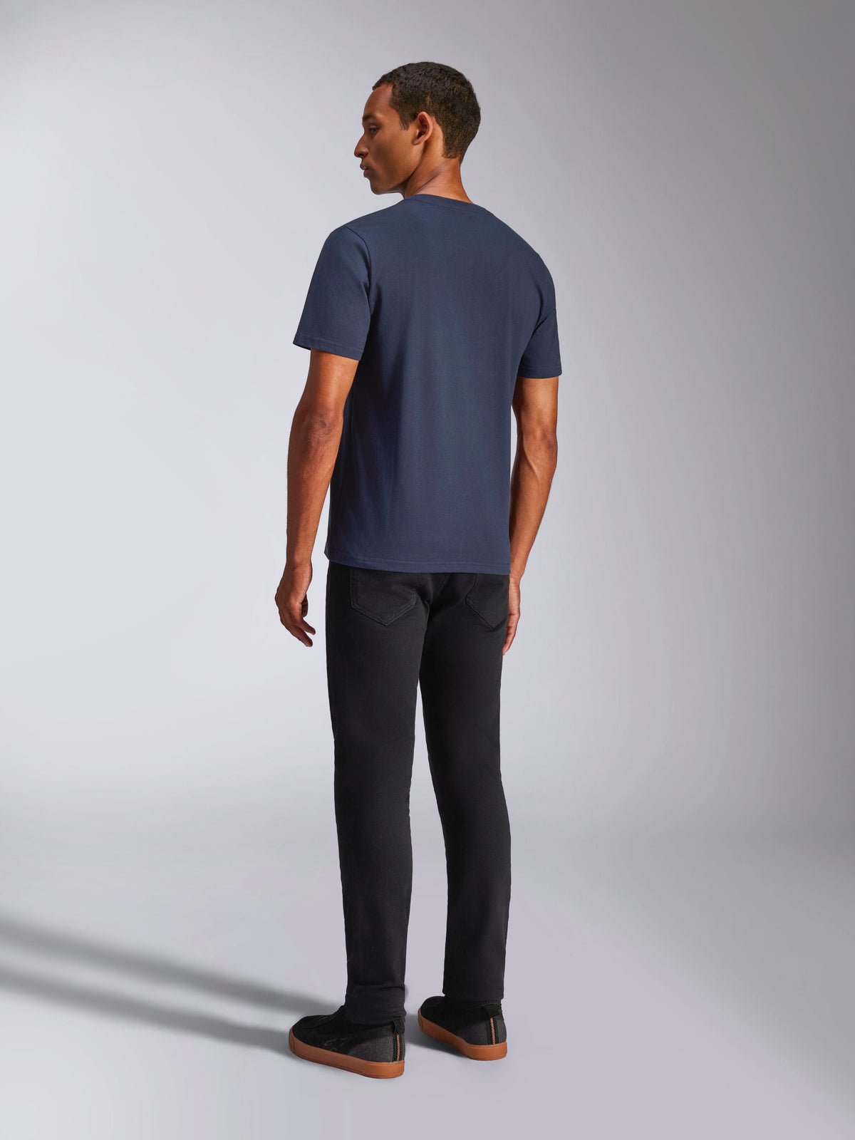Alpinestars Ride 4.0 CSF Tee, Navy Blue, Short Sleeve T-Shirt, Back View, worn by model with black pants, casual motorsport-inspired lifestyle wear