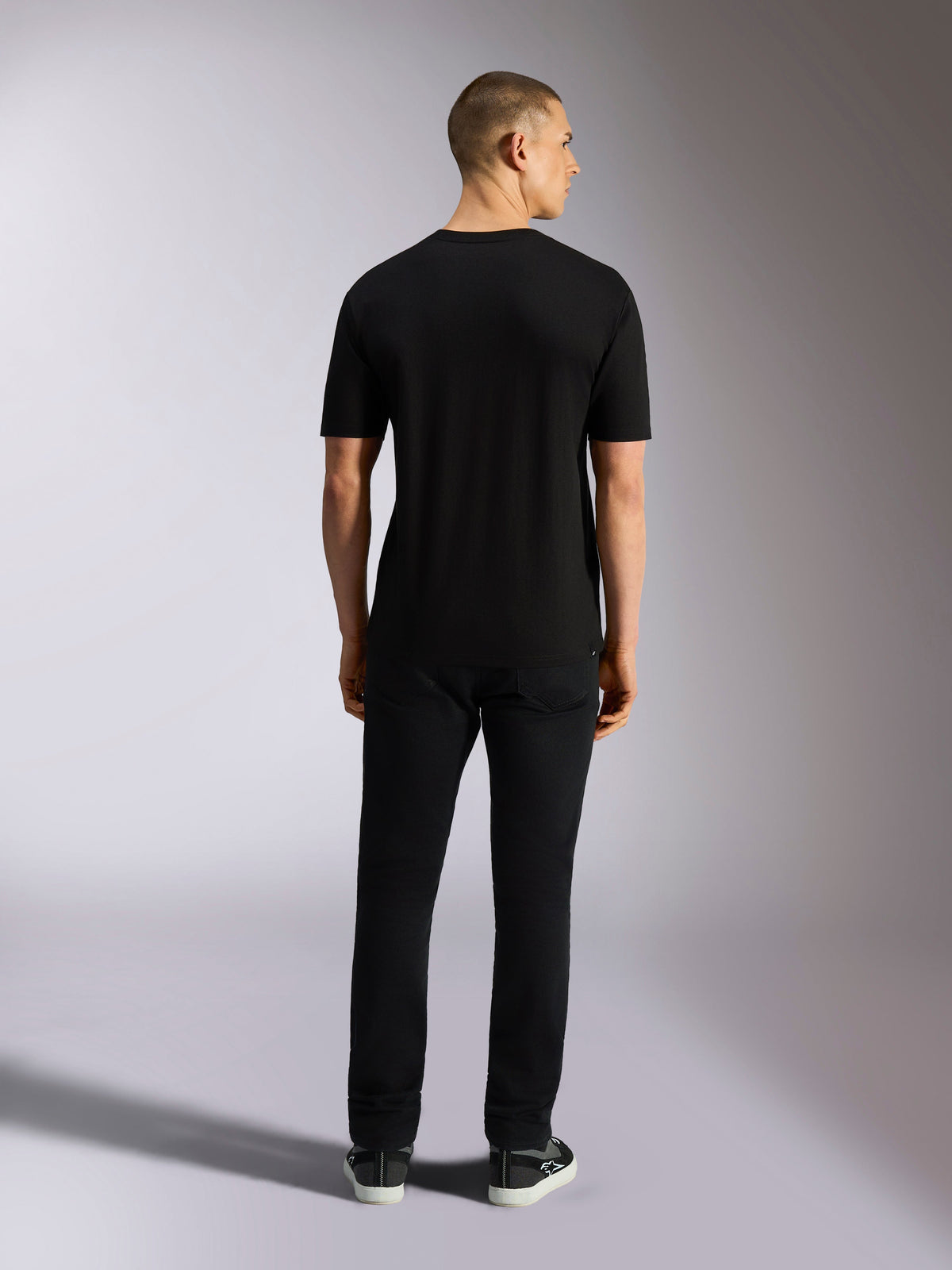 Alpinestars MX CSF Tee, Short Sleeve T-Shirt, Black, rear view on model wearing black pants, casual motorsport-inspired apparel