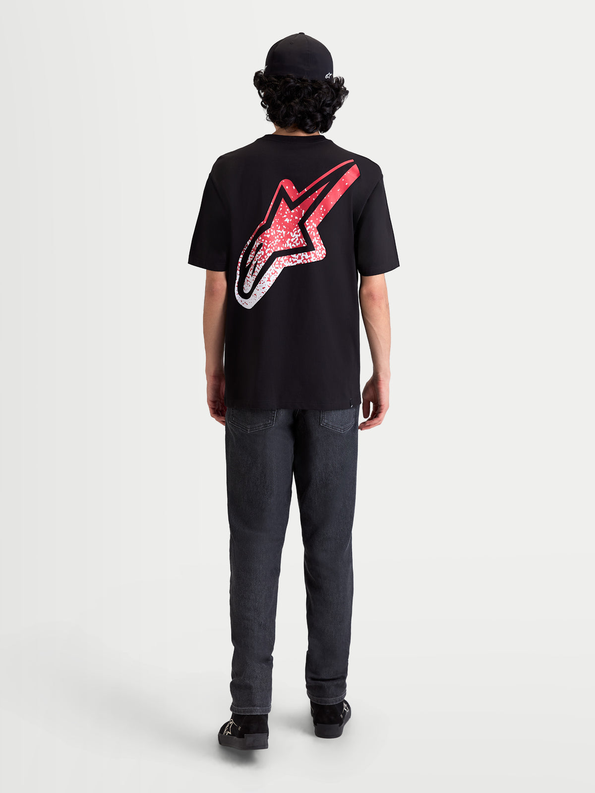 Alpinestars Meteor CSF, t-shirt de sportswear à manches courtes, noir, vue de dos sur mannequin avec un grand logo Astars et un graphique dégradé rouge et blanc inspiré du MX, style décontracté.