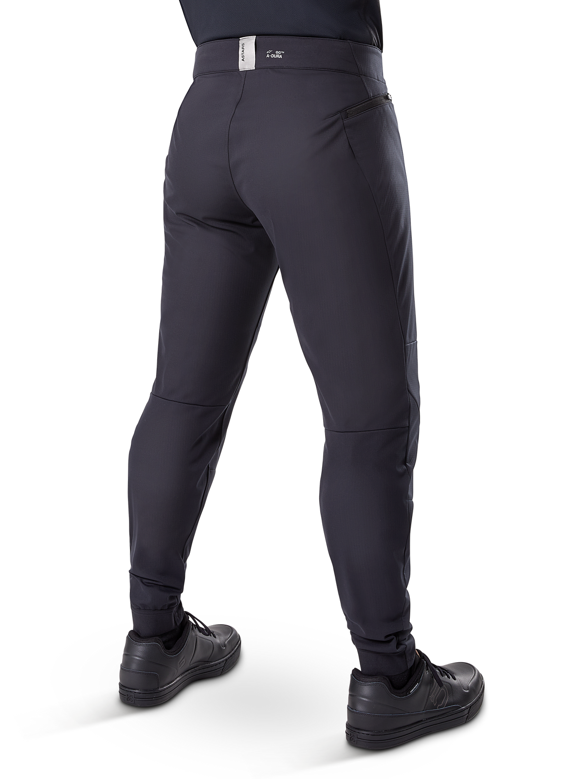 Alpinestars Pantalon Thermique A-Dura, pantalon de VTT, noir, vue arrière montrant les poches zippées et le marquage sur la ceinture, coupe ajustée pour le cyclisme par temps froid