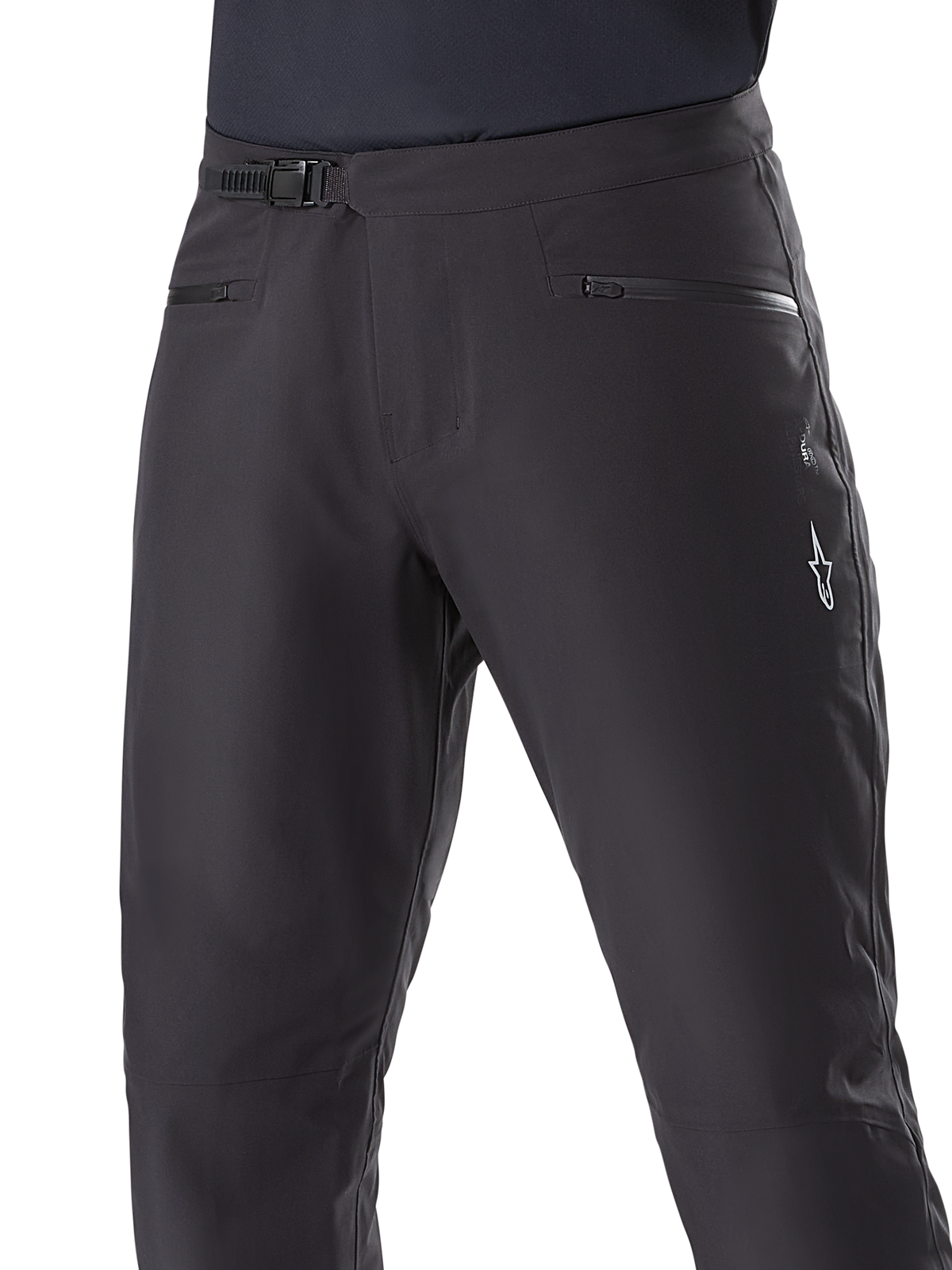 Alpinestars A-Dura Waterproof Pants, Mountain Bike Pants, Black, close-up of waist showing ratchet closure system and zippered pockets, featuring a white Alpinestars logo on the thigh, durable textile for wet-weather trail riding