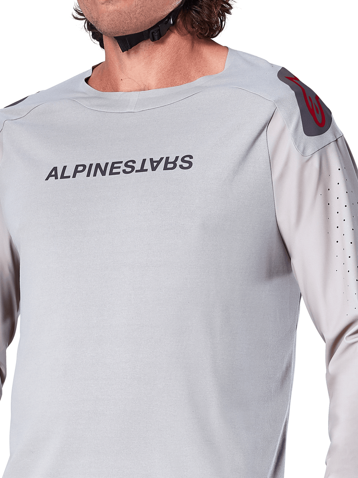 Close-up of the Alpinestars A-Aria Polartec Switch Long Sleeve Jersey in Light Gray, featuring Alpinestars chest branding, red shoulder logo, and laser-perforated sleeves for airflow, premium mountain bike gear.