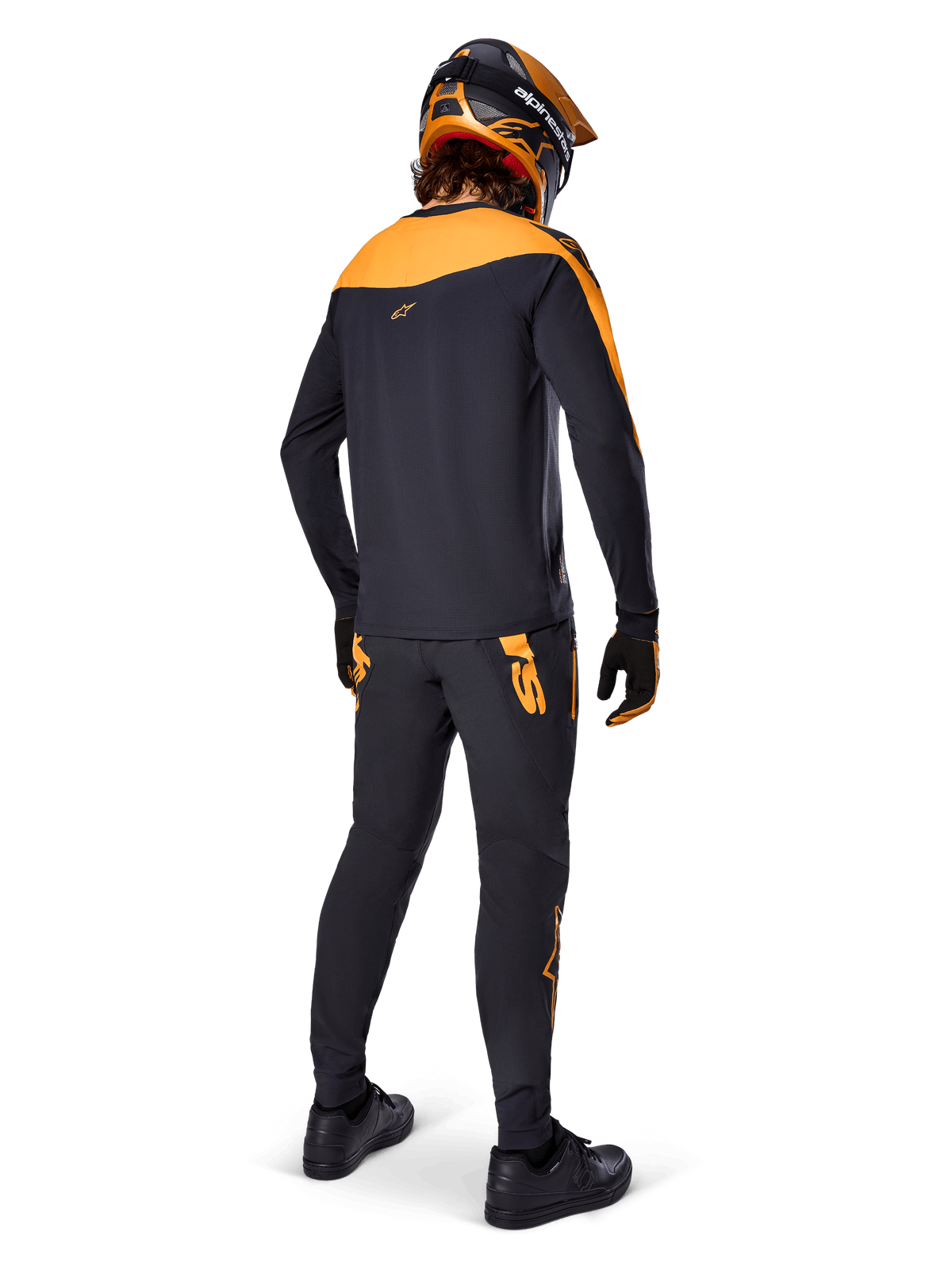 A-Supra Race Jersey - Long Sleeve, Black and Orange, rear view of a rider wearing matching MTB pants, orange and black helmet, and gloves, performance gear for mountain bike racing