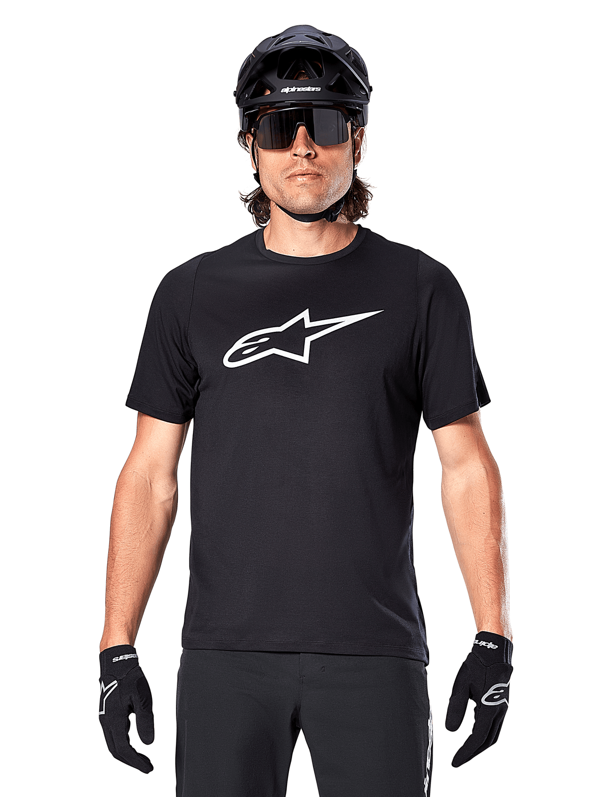 Alpinestars A-Dura Dri Oscar Jersey - Short Sleeve, Black Reflective, worn with black MTB helmet, sunglasses, and gloves, featuring a prominent white logo on the chest, performance gear for mountain biking
