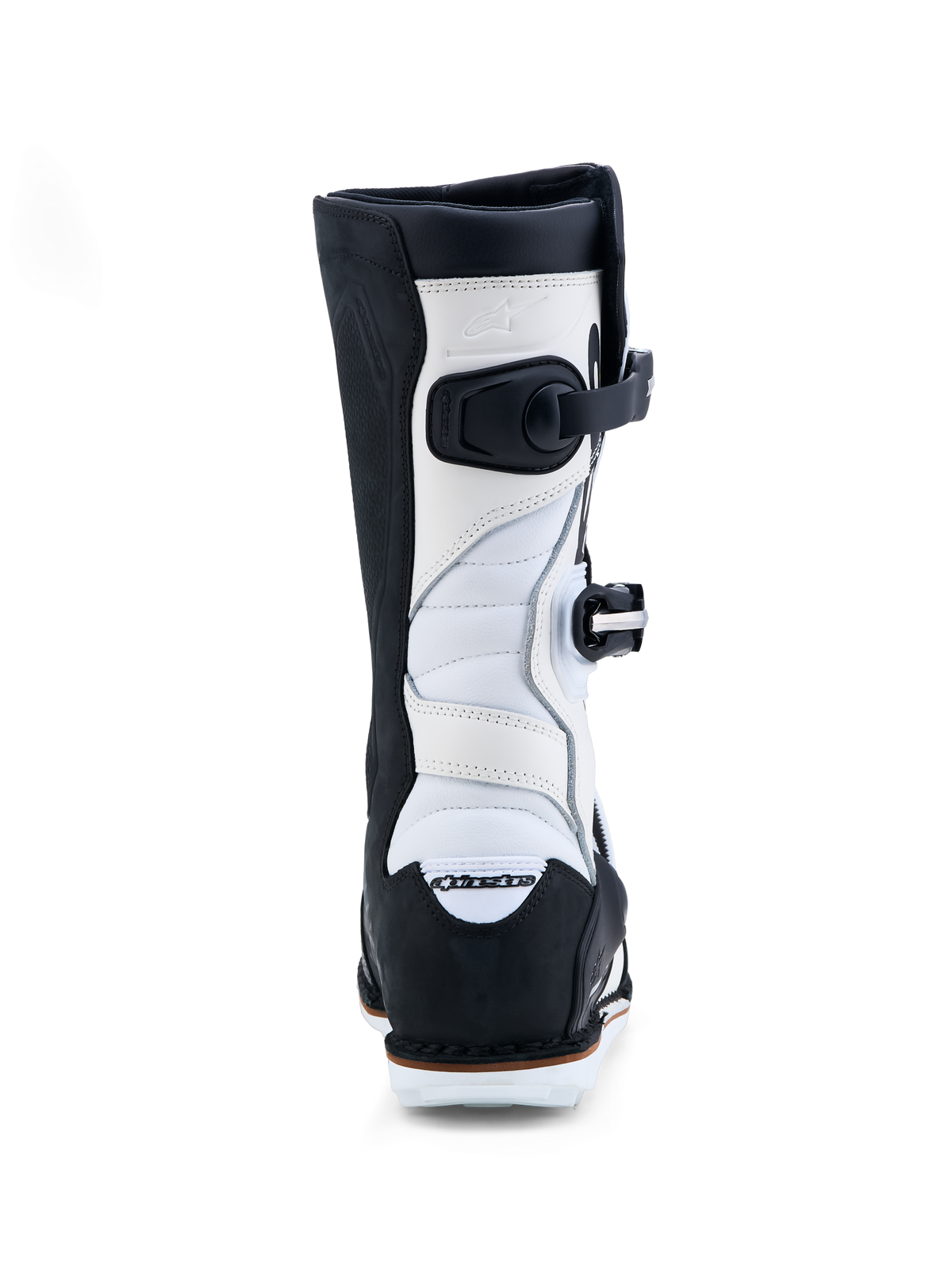 Alpinestars Tech-T, bottes de moto de trial pour homme, noires et blanches, vue arrière montrant les zones d'extension en accordéon et le système de boucles, construction en cuir premium
