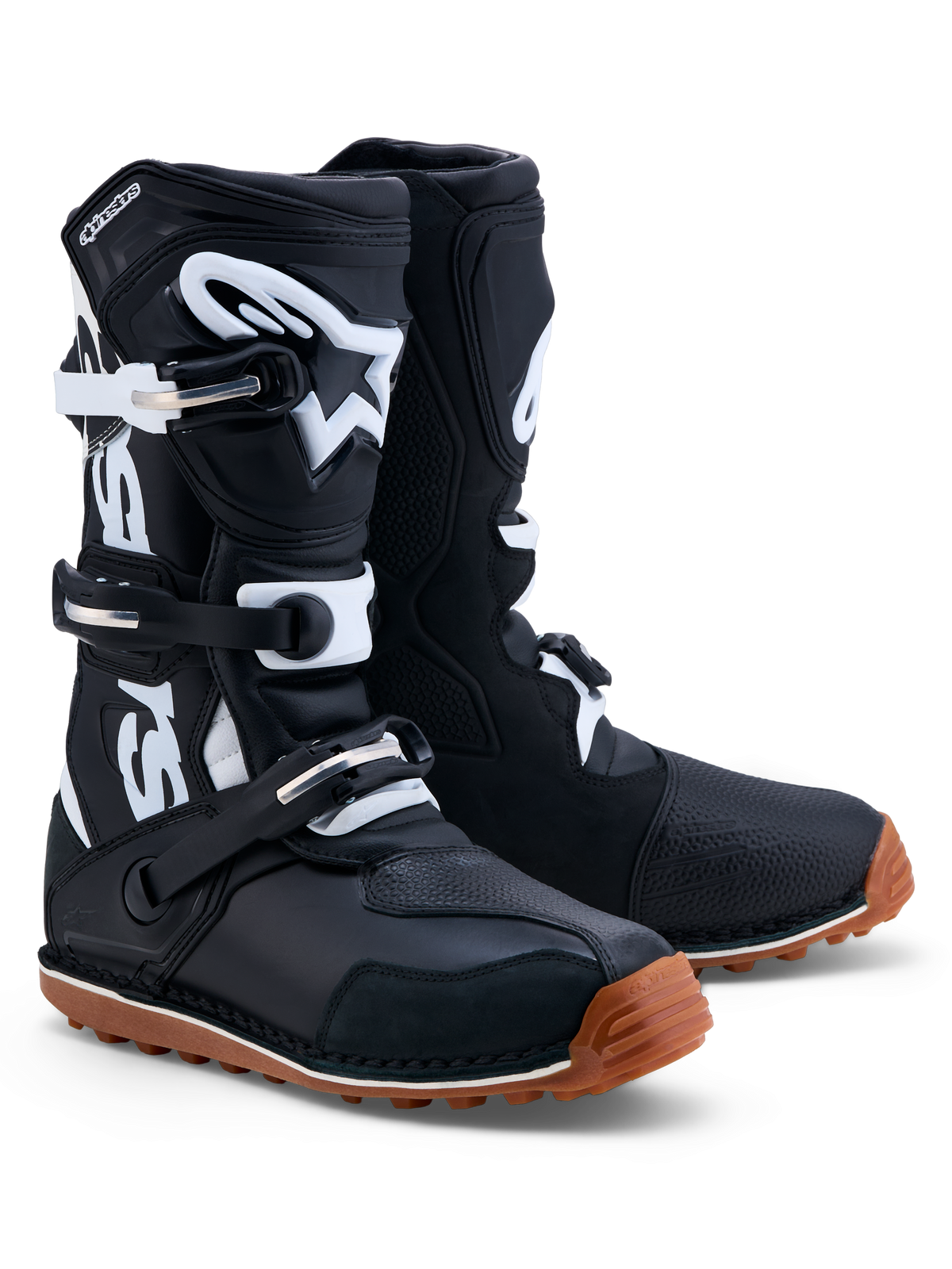 Bottes Alpinestars Tech-T, bottes de moto pour le trial pour homme, noires et blanches, construction en cuir avec plaque tibiale en TPU et semelle en caoutchouc gomme adhérente