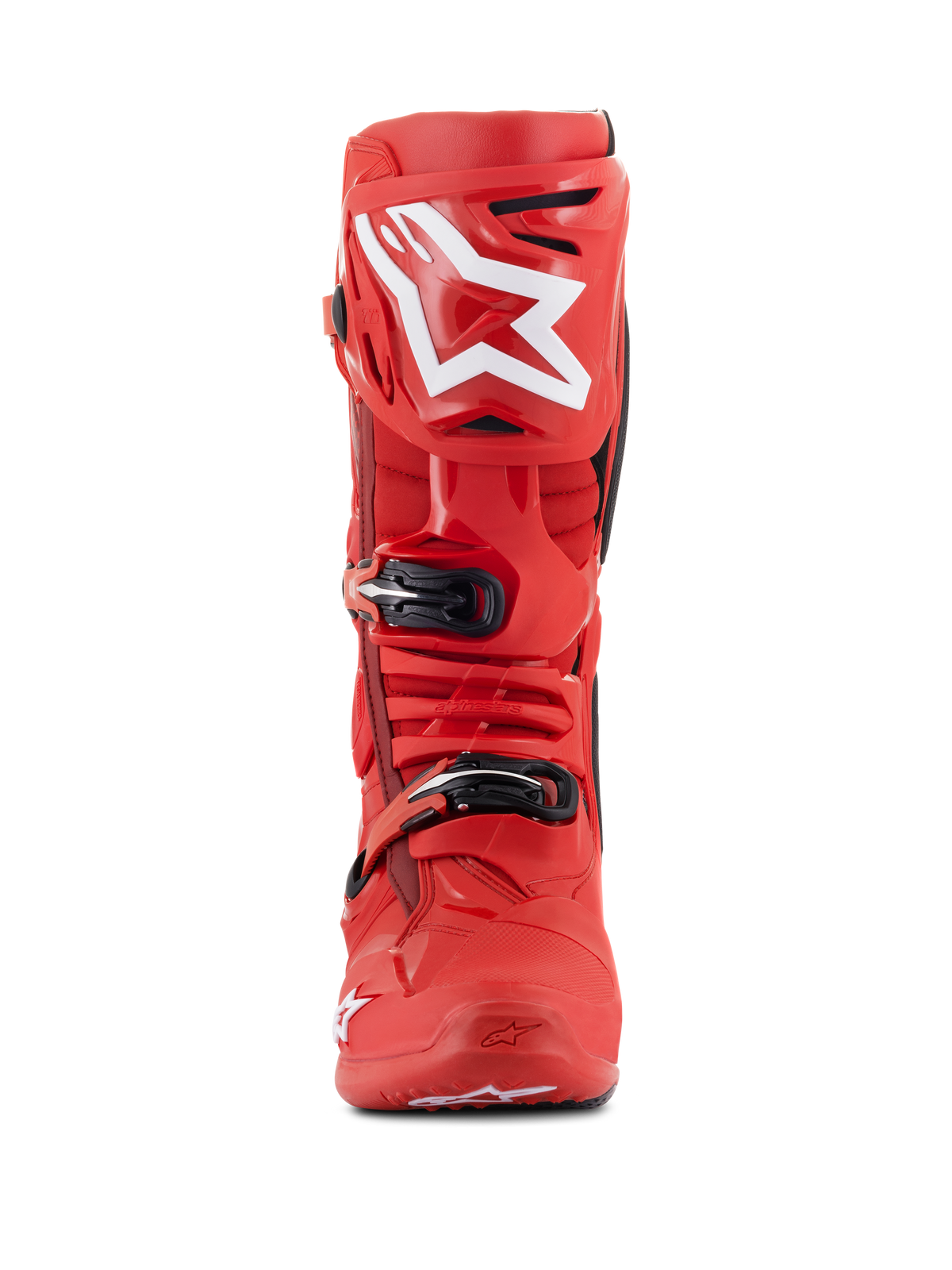 Bottes Alpinestars Tech 10, bottes de motocross, rouges, vue de face avec un grand logo Alpinestars blanc sur le protège-tibia, fermetures à boucles noires et coque en TPU durable pour la performance en course tout-terrain