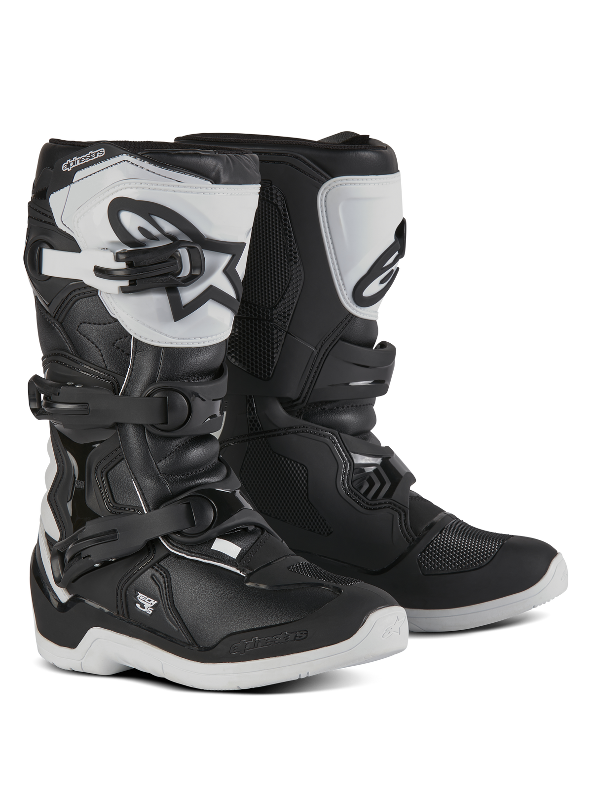 Alpinestars Youth Tech 3S Boots, Motocross Boots for young riders, Black and White, featuring three adjustable buckle straps, white TPU shin plate with Alpinestars logo, reinforced hard shell protection, and a sturdy white treaded sole, off-road racing design
