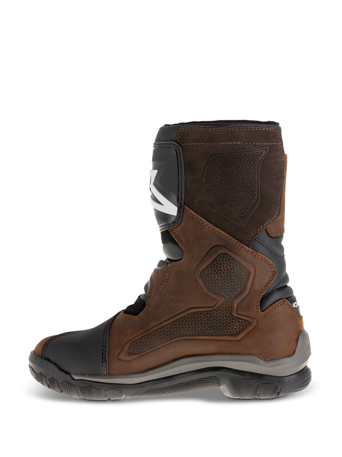 Alpinestars Belize Drystar® Boots, short-calf adventure touring motorcycle boots, oiled brown leather with black and grey accents, showing the medial side with a large heat-press textured grip panel, TPU shin plate, and rugged vulcanized rubber sole