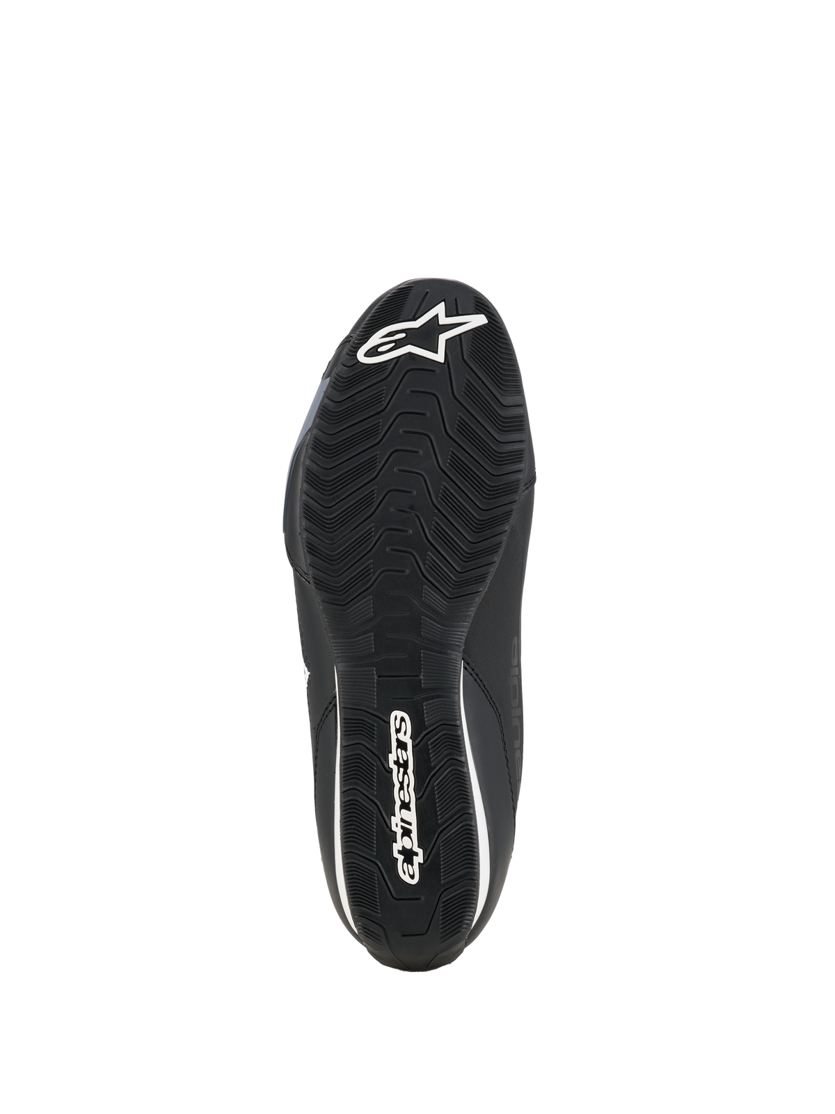 Chaussures Alpinestars Celer, chaussures de pilotage moto, noir et blanc, vue de dessous de la semelle en caoutchouc résistante à l'huile avec motif d'adhérence texturé et logo Alpinestars blanc.