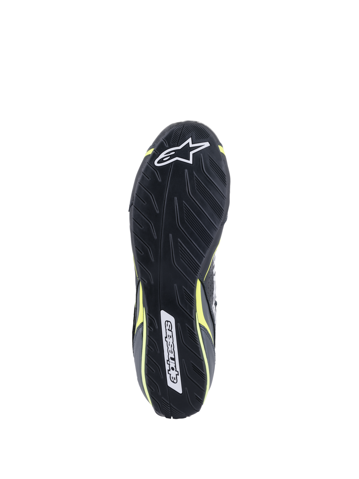 Alpinestars Tech-1 T V3 Shoes FIA, Outsole view, Black with Yellow Fluo accents, asymmetric tire-tread inspired rubber sole, featuring Alpinestars logos and textured pattern for pedal sensitivity and grip.