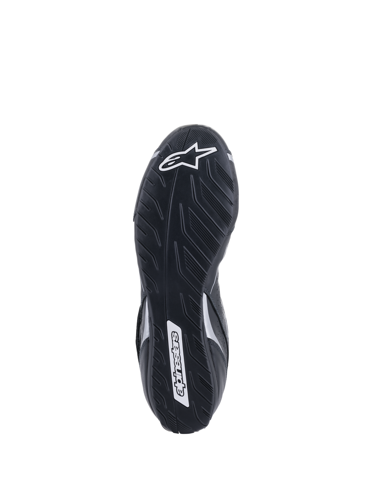Alpinestars Tech-1 T V3 Shoes FIA, vue de la semelle extérieure, noir et argent, semelle asymétrique en caoutchouc avec motif de bande de roulement de pneu, logo Alpinestars blanc, composé mince pour une sensibilité optimale aux pédales