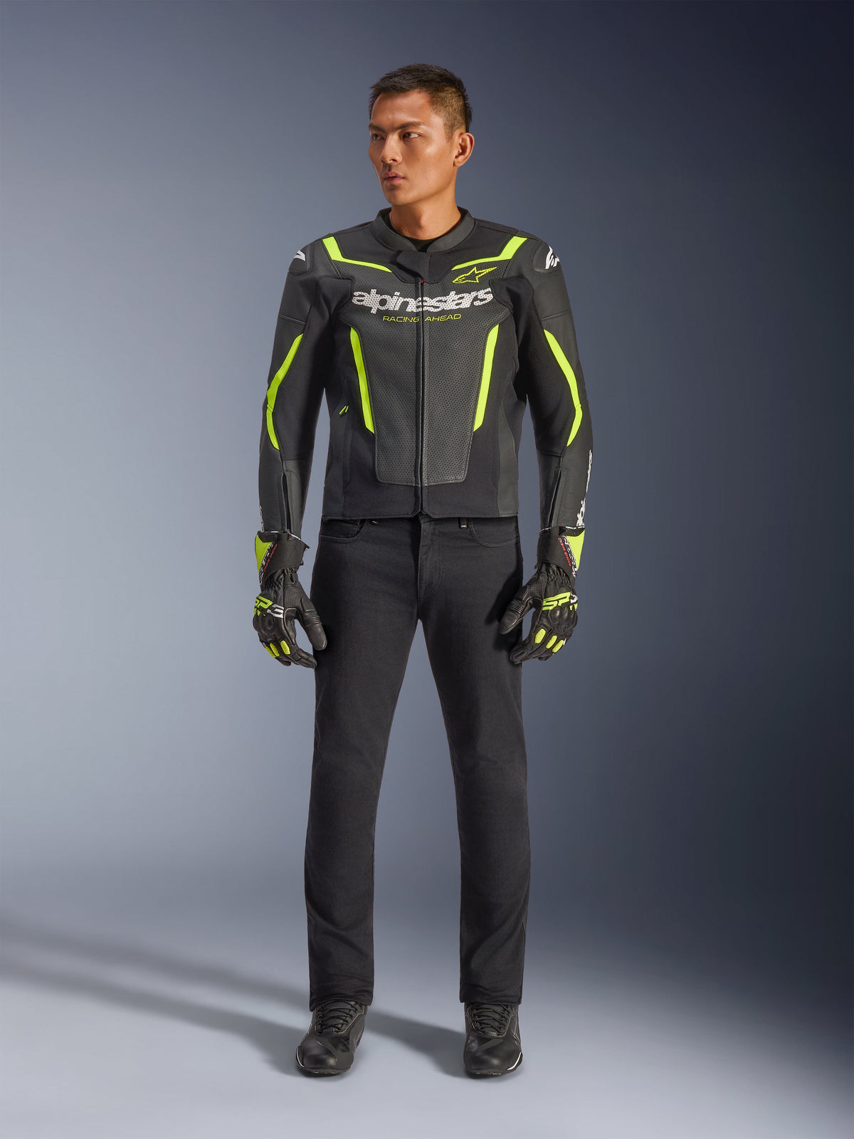 Alpinestars GP Force V2 Air Leather Jacket, Black and Yellow Fluo, perforated leather sport jacket with bold yellow accents and Alpinestars branding, worn with black pants and matching motorcycle gloves