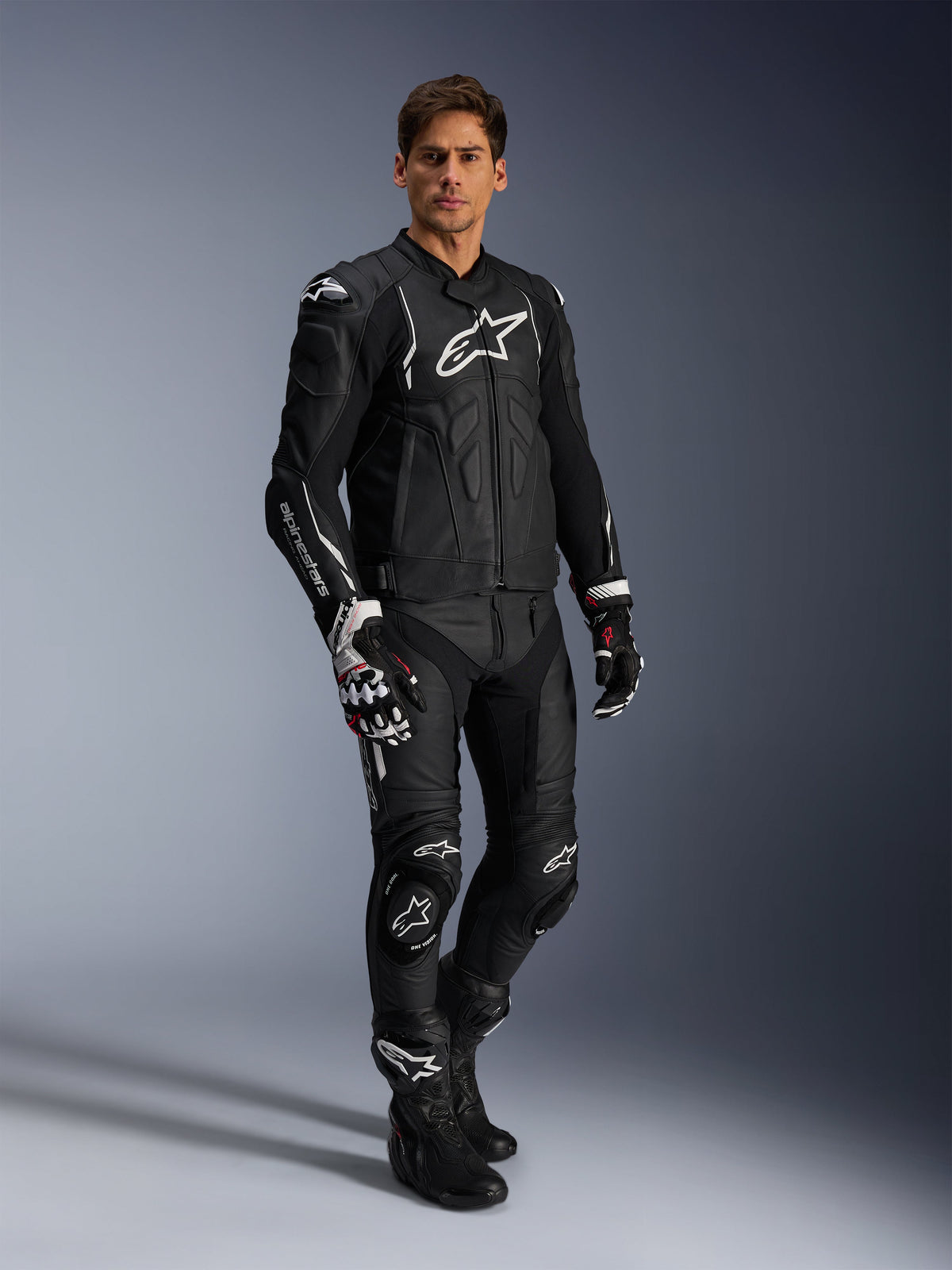 Alpinestars Missile V3 Leather Pants and matching black leather jacket, full motorcycle racing suit, black with white Alpinestars branding on chest and knees, includes professional racing gloves and boots, sleek protective gear for road and track.