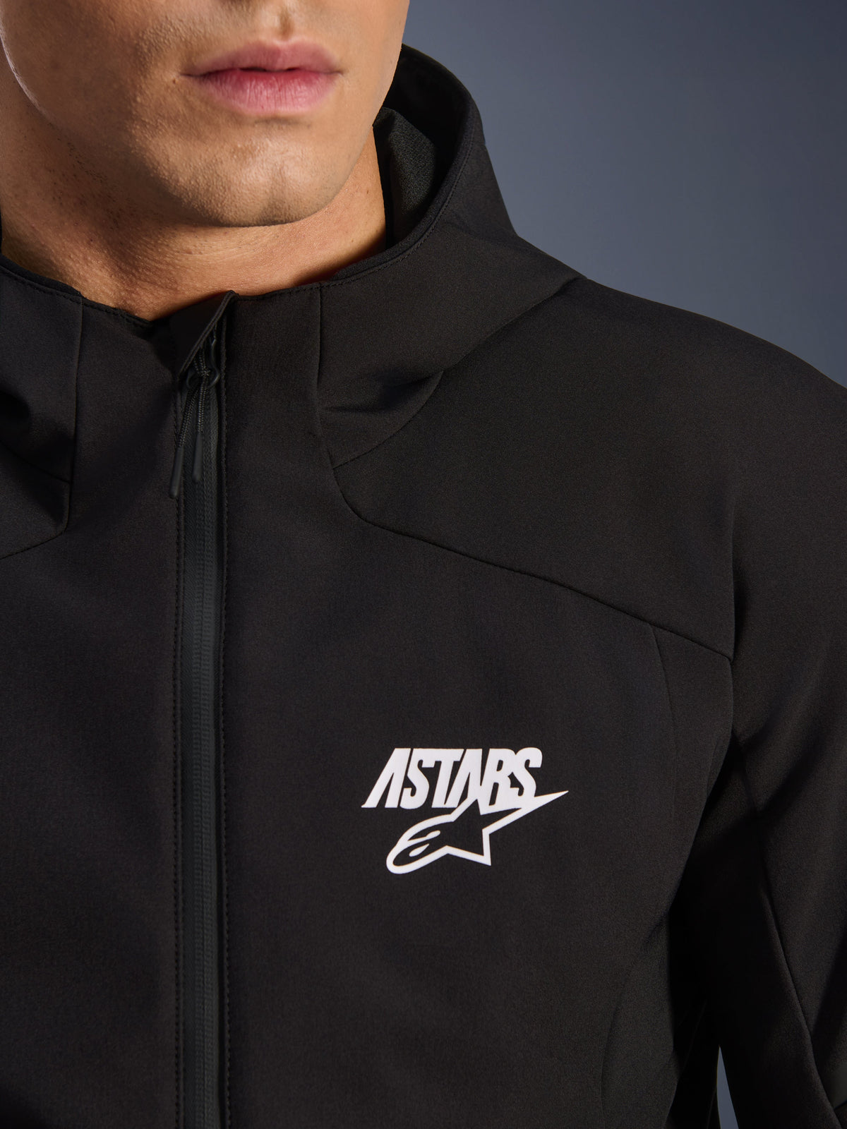 Alpinestars Aeroshell Waterproof Jacket, black men's motorcycle softshell with white ASTARS logo and waterproof zipper.
