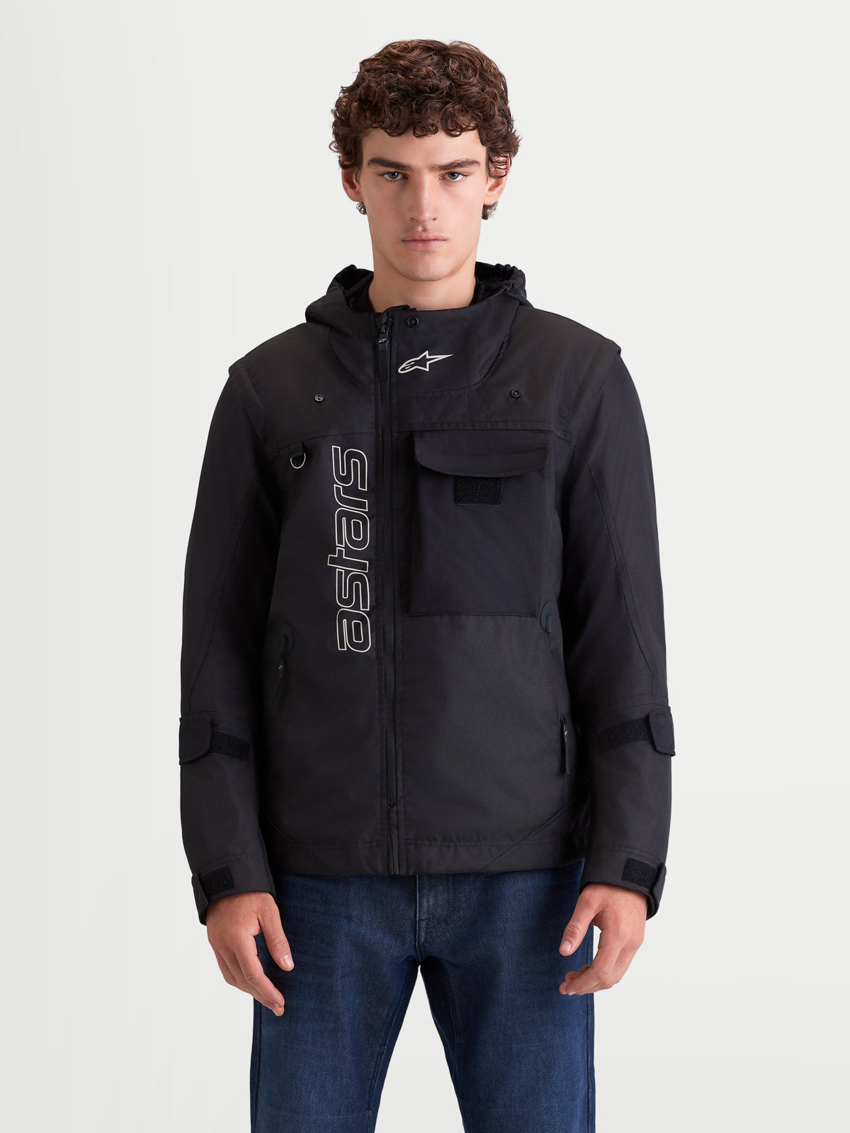Alpinestars Morfex Parka Waterproof Jacket, men's urban contemporary motorcycle textile jacket in black, front view on a model showing modular parka styling, integrated hood, and chest pocket details