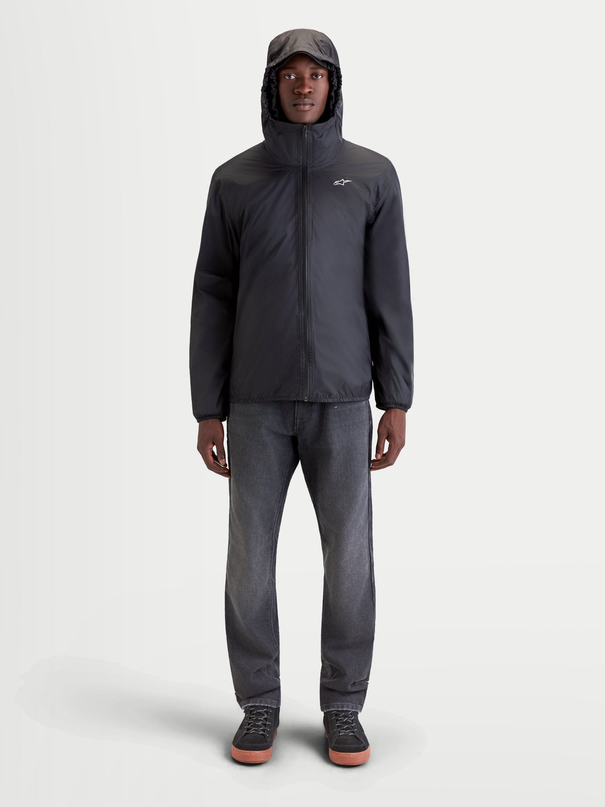 Alpinestars Morfex Parka Waterproof Jacket, men's urban contemporary motorcycle jacket in lunar gray and black, front view on a model wearing the waterproof textile jacket with an integrated hood up.