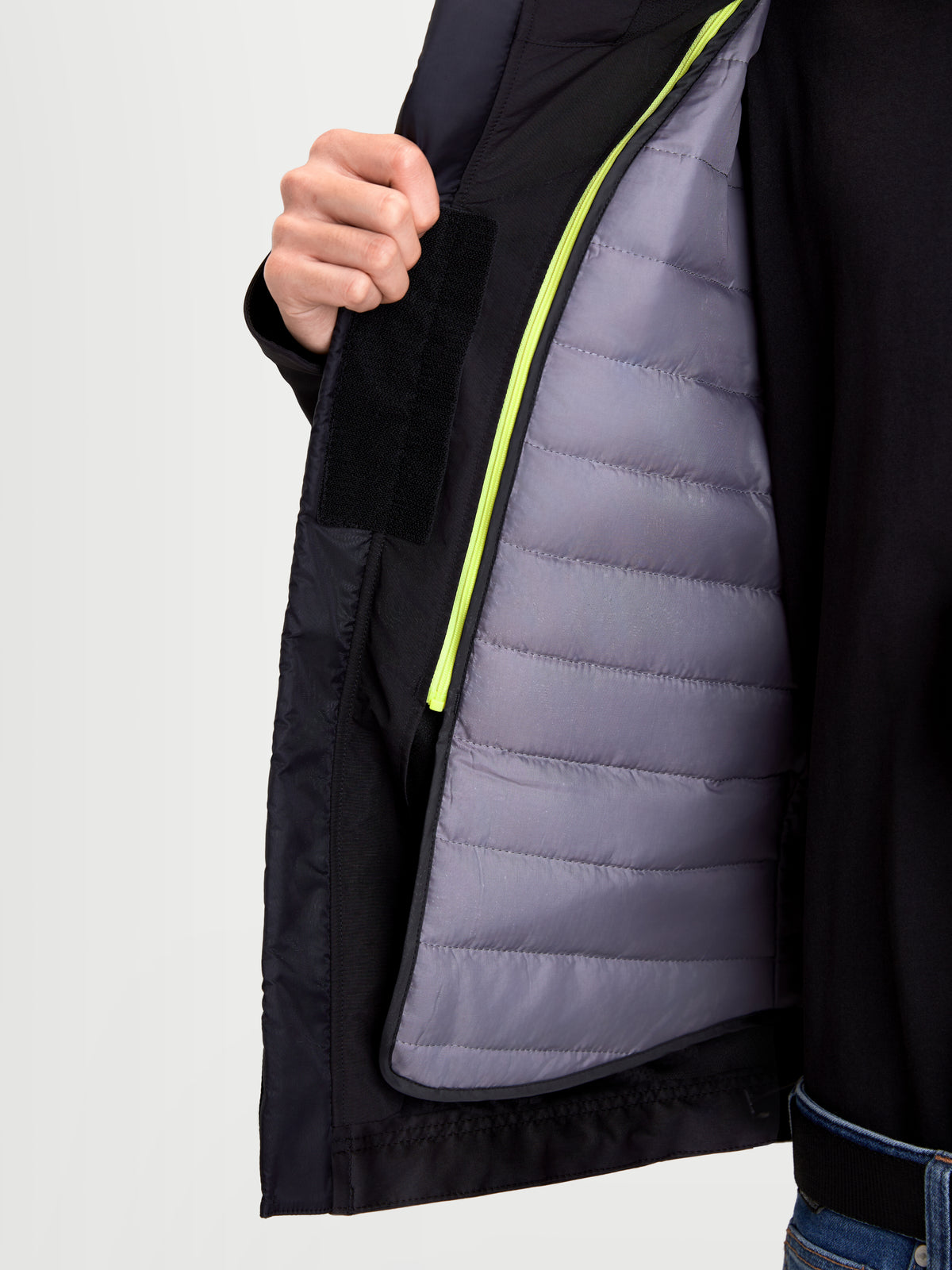 Alpinestars C-5 Drystar Jacket, men's urban contemporary motorcycle textile jacket in black, close-up view showing the detachable thermal vest and waterproof softshell construction worn by a model.