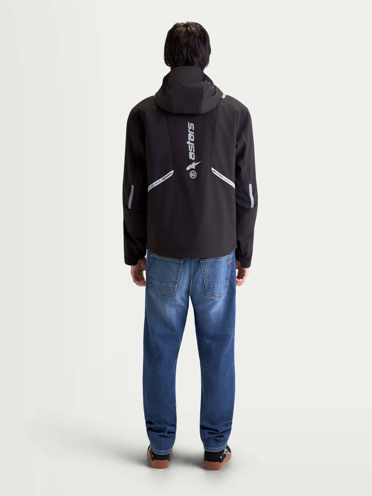 Alpinestars C-5 Drystar® Jacket, men's urban contemporary motorcycle textile jacket in black, rear view on a model wearing the jacket with integrated hood and reflective detailing