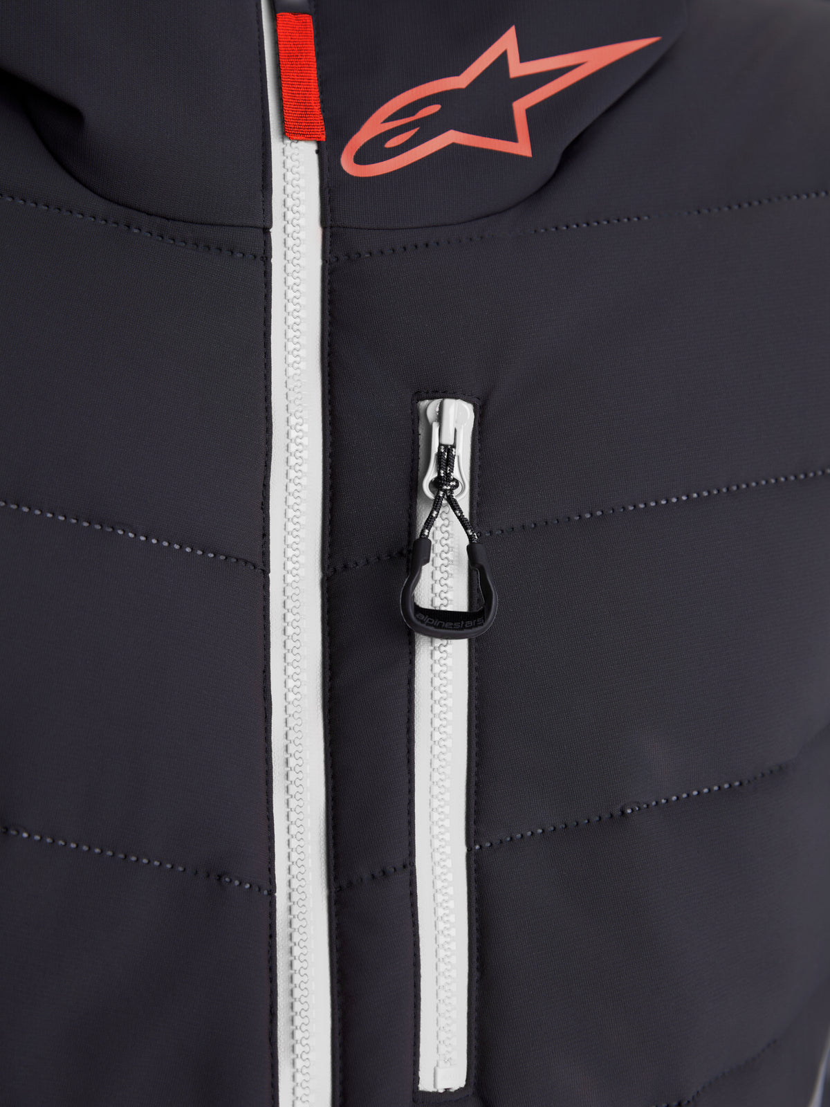 Alpinestars Therma-Tech Waterproof Jacket, urban contemporary motorcycle jacket, close-up view of sonic-welded down construction, white waterproof main zipper, and Alpinestars branding, black and dark gray with red accents