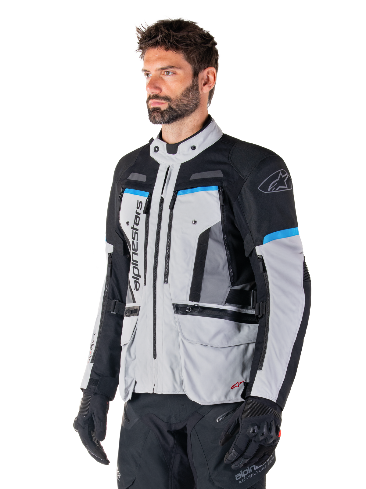 Veste Alpinestars Bogota' Pro Drystar®, veste de moto adventure homme, gris glacier, noir et cyan, imperméable et ventilée.