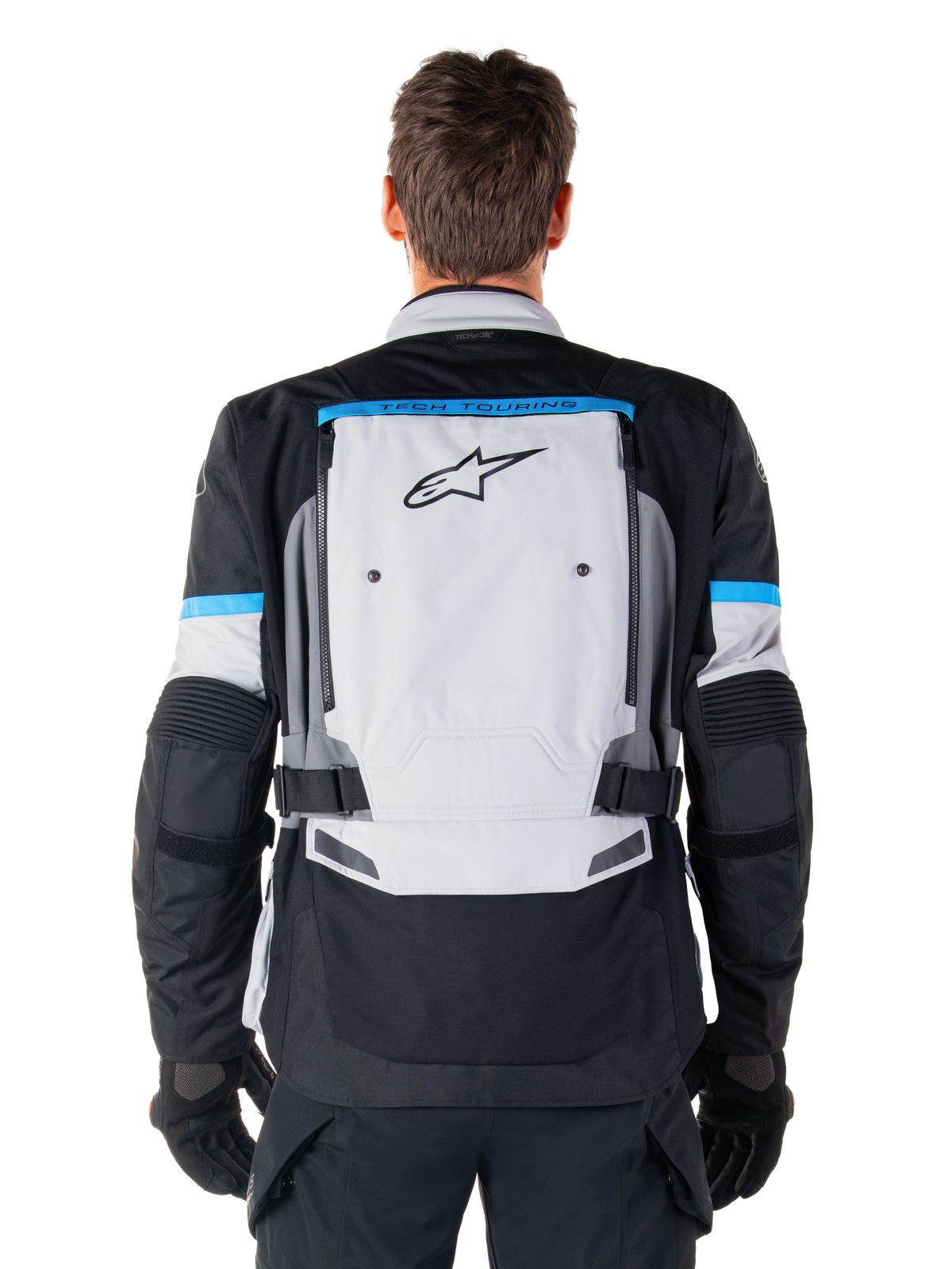 Veste Alpinestars Bogota' Pro Drystar®, veste de moto aventure touring, grise et noire, vue arrière avec détails cyan.