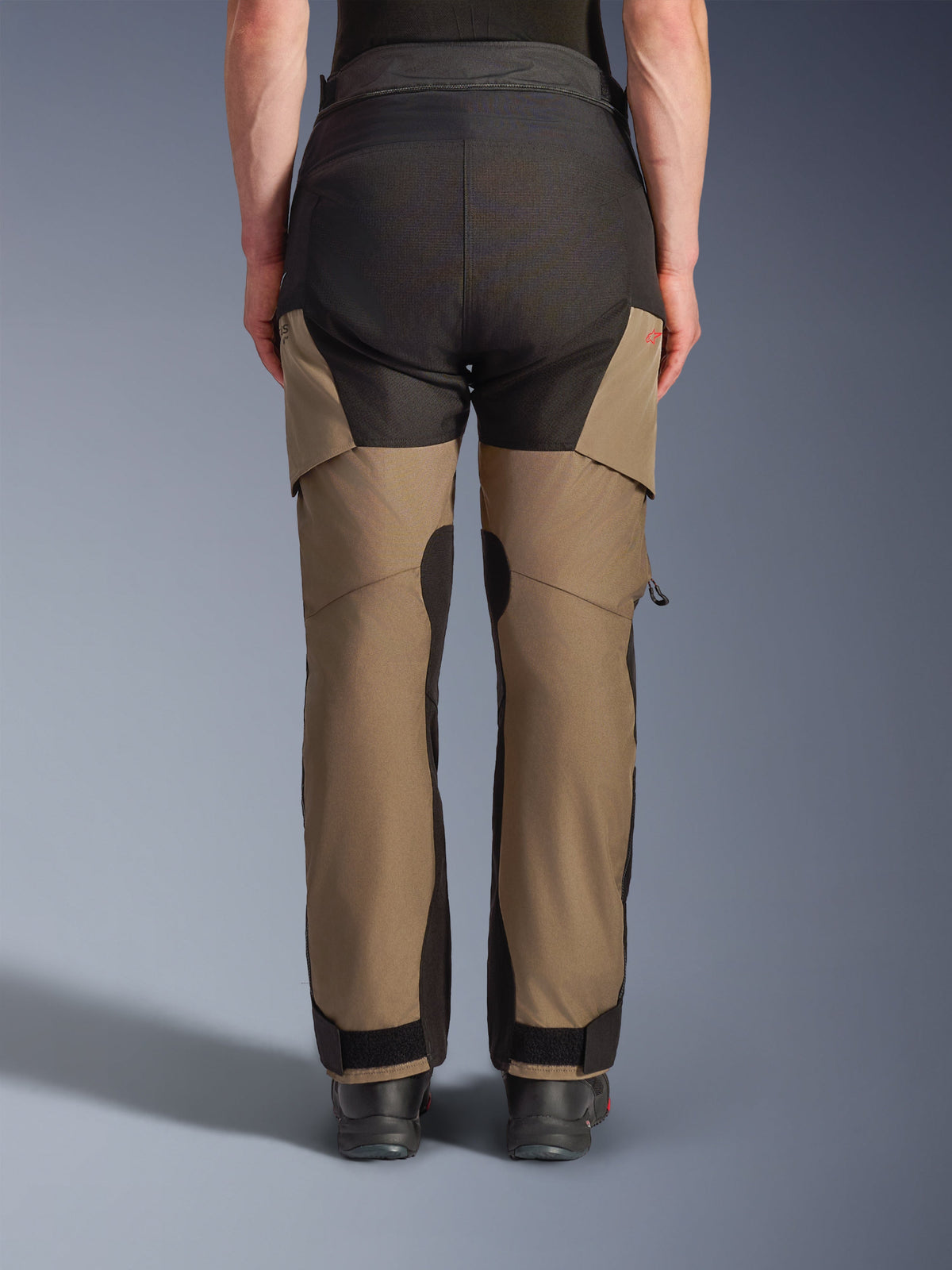 Alpinestars Andes V4 Drystar® Pants, Motorcycle Adventure Touring Pants, Walnut and Black, back view featuring reinforced black seat panels, red logo detail, and adjustable ankle closures.