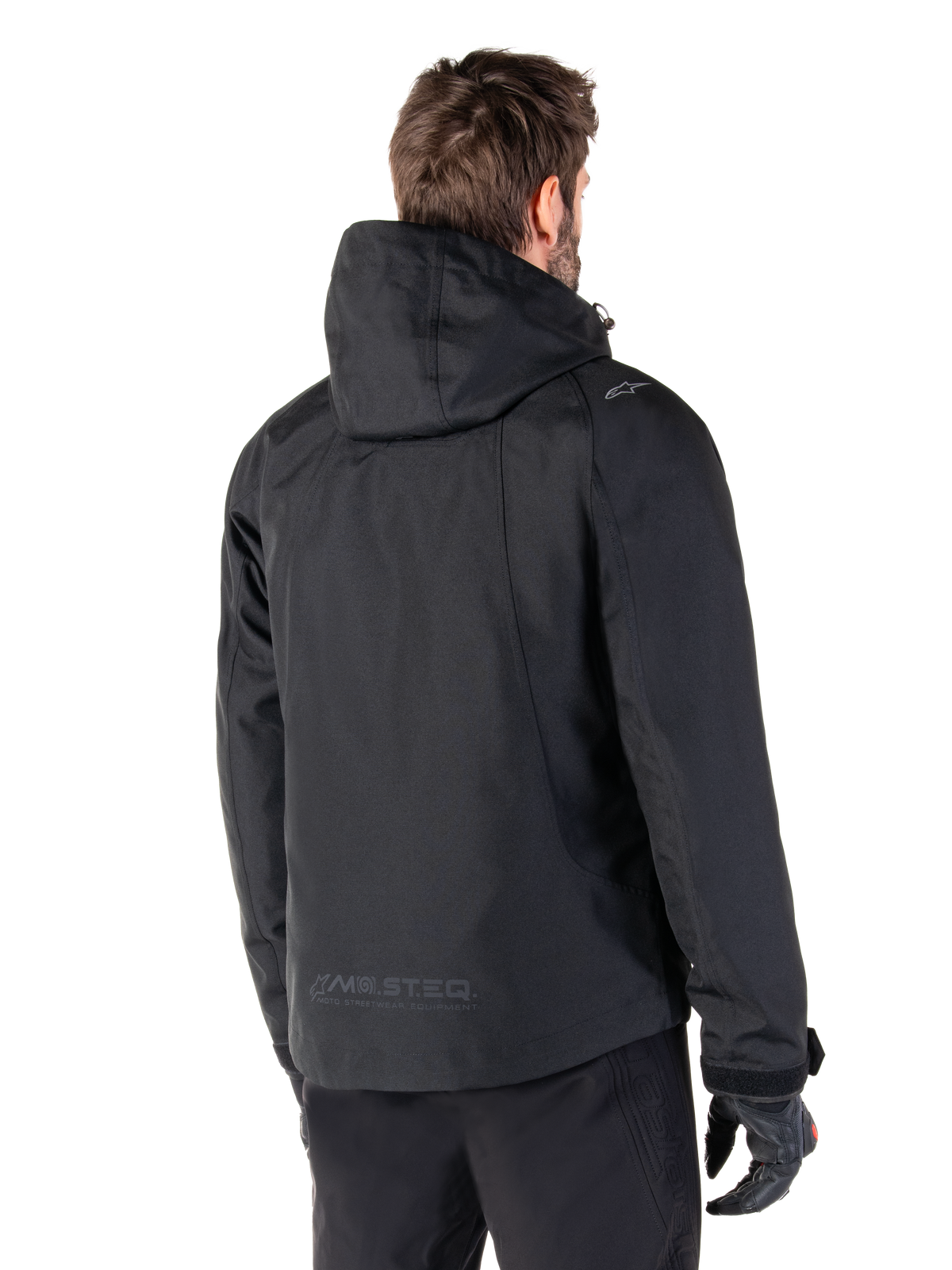 Parka imperméable Alpinestars Morush, veste de moto urbaine noire pour homme, vue de dos à capuche avec marquage MO.ST.EQ.