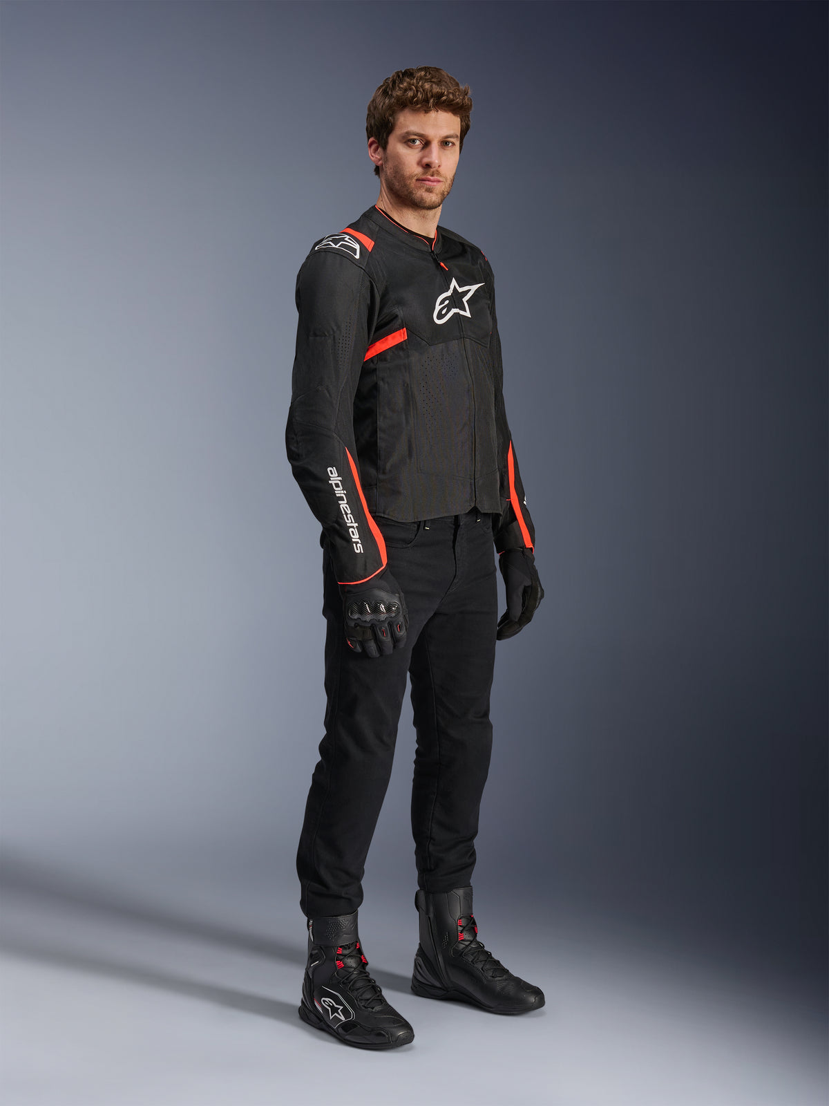 Alpinestars T-SPS Air V2 Jacket, men's black and red fluo textile motorcycle jacket with ventilated mesh panels.