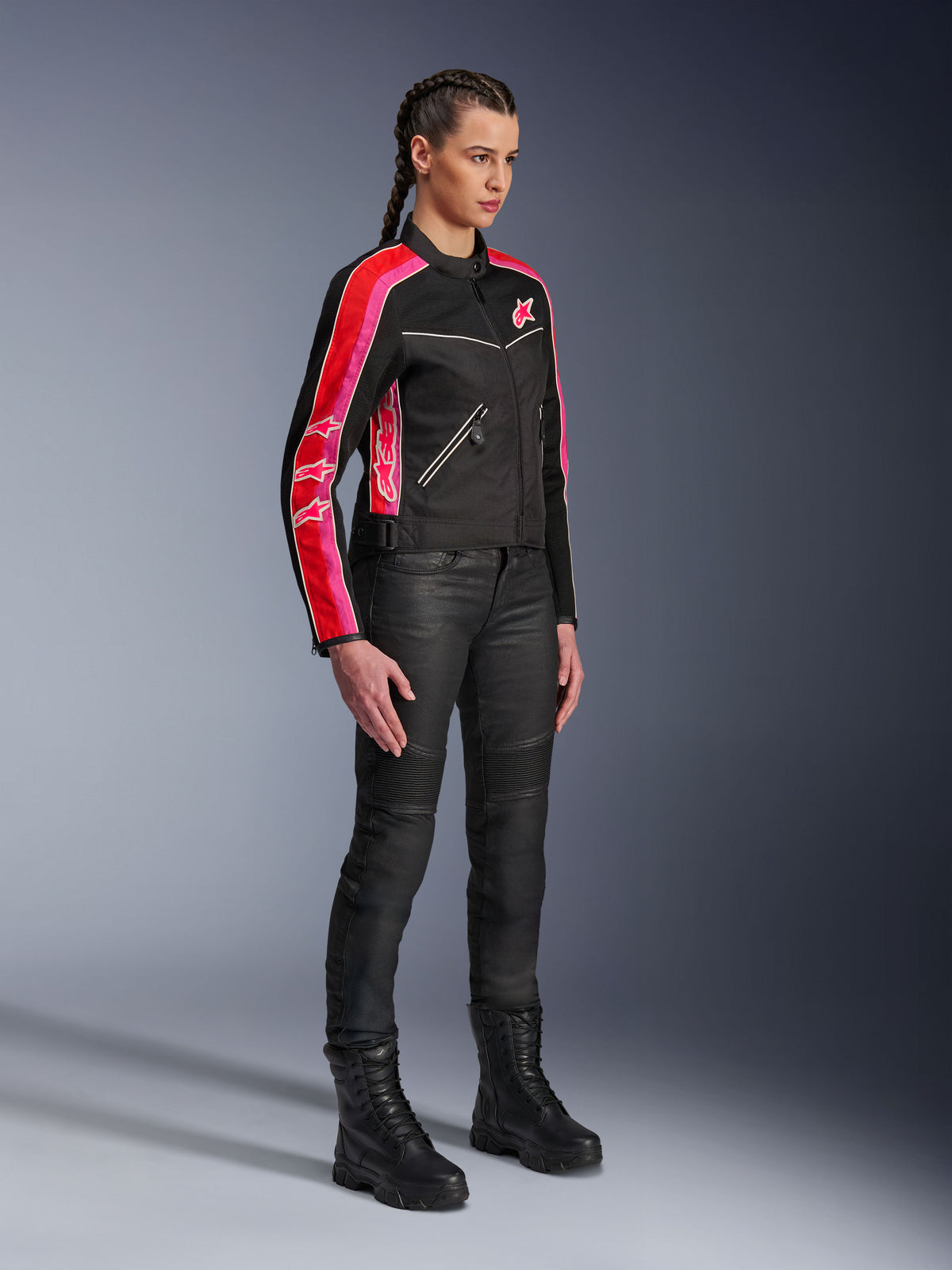 Alpinestars Stella T-Dyno Air Jacket, Women's Motorcycle Jacket, Black with Bright Red and Fuchsia stripes on sleeves, worn with black riding pants and boots, vintage-inspired mesh design for urban riding