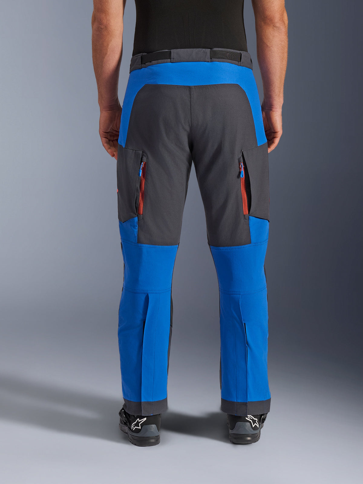 Alpinestars Maxdura Dual Pants, Adventure Motorcycle Pants, Royal Blue and Deep Gray, back view featuring vertical zippered vents on the thighs and reinforced seat panels, over-the-boot design, technical gear for dual-sport riding