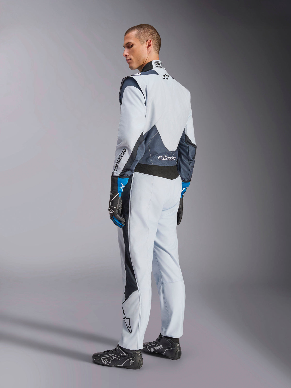 Alpinestars GP Pro Comp V2 FIA Suit in Silver and Blue, Men’s Auto Racing gear with rear stretch panels.