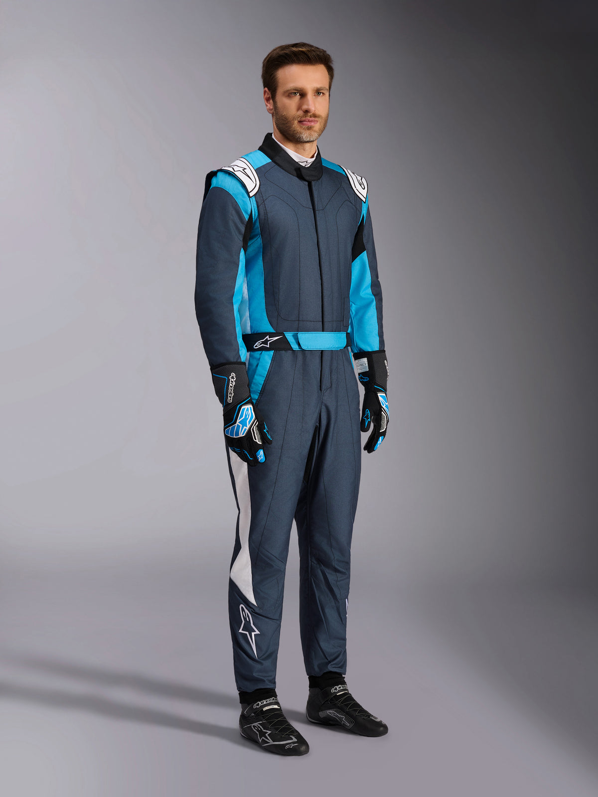 Alpinestars GP Pro Comp V2, combinaison de course auto professionnelle pour homme, asphalte et cyan, certifiée FIA.