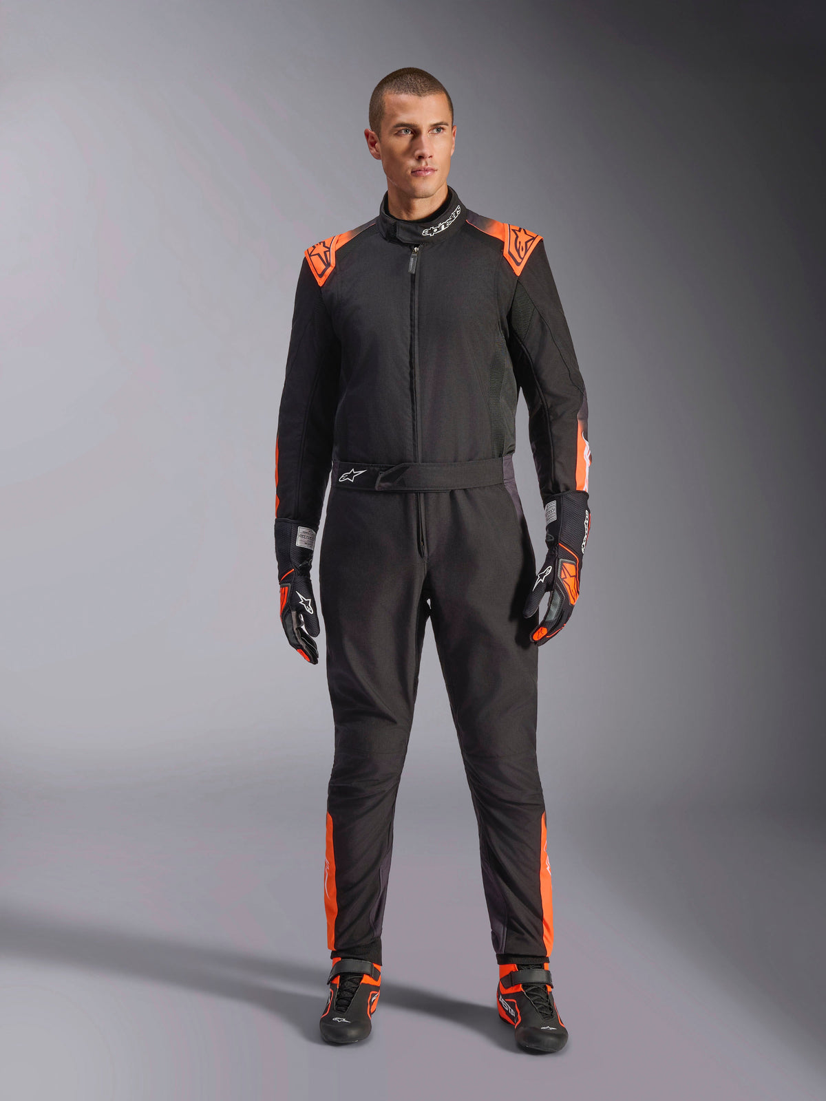 Alpinestars KMX-5 V3, combinaison de karting une pièce pour homme, noire et orange fluo, certifiée FIA 8877-2022 Grade 1.