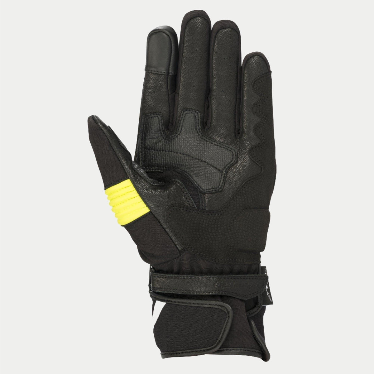 Gants Alpinestars T-SP W Drystar®, Noir et Jaune Fluo, vue de la paume montrant la construction en peau de chèvre avec des accents jaune fluo sur le pouce, extrémités des doigts compatibles avec les écrans tactiles et double fermeture velcro au poignet.