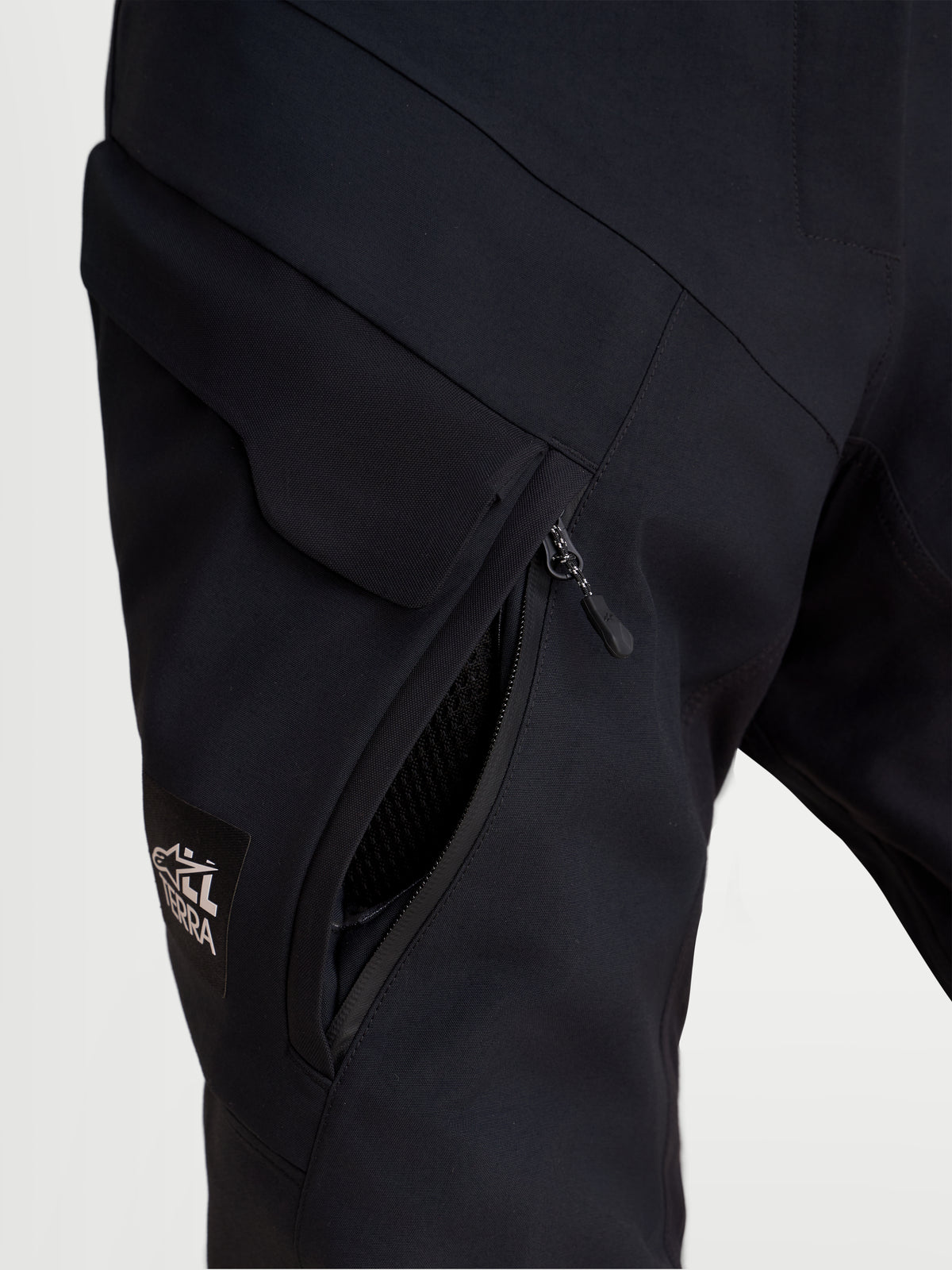 Alpinestars Stella ST-7 V2 2L Gore-Tex Pants Short, women's adventure touring motorcycle pants, black, close-up view showing waterproof cargo pocket and thigh ventilation opening