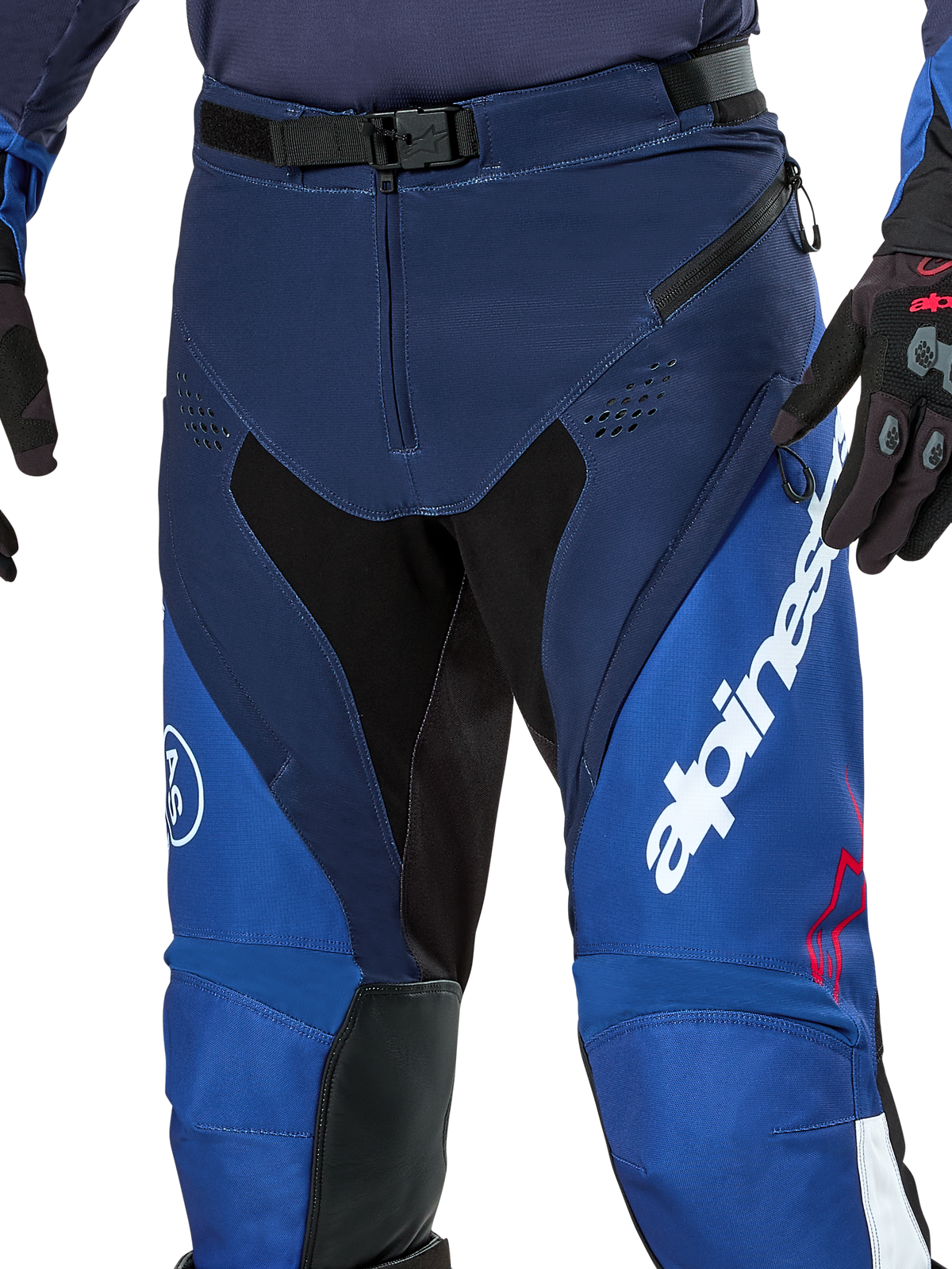 Alpinestars Pro-Dura Pants, Enduro and Motocross Pants, Navy Bright Blue and White, close-up view showing the SX2 magnetic buckle waist closure, zippered thigh vents, and durable stretch panels with bold white branding.