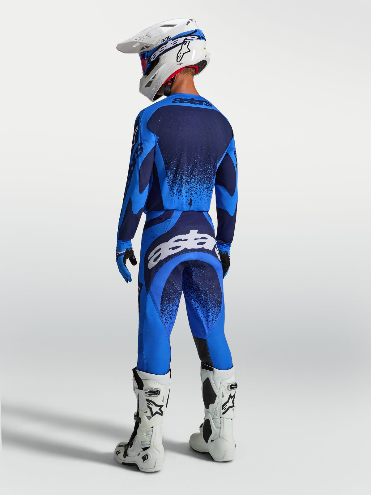 Alpinestars Techstar Swan, pantalon de motocross pour homme, bleu et blanc, vue de dos avec une coupe de course athlétique