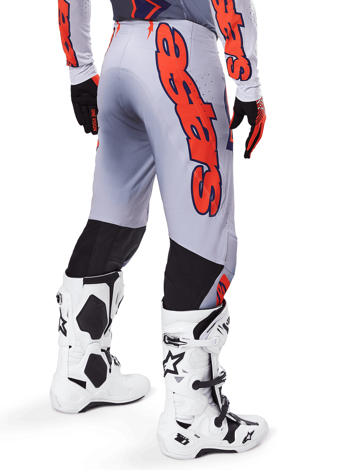 Alpinestars 2025 Supertech Lipan Pants, Motocross Pants, Gray and Orange Fluo, worn with matching jersey and white boots, back view featuring large orange Alpinestars graphic branding, black stretch panels, professional dirt bike racing gear