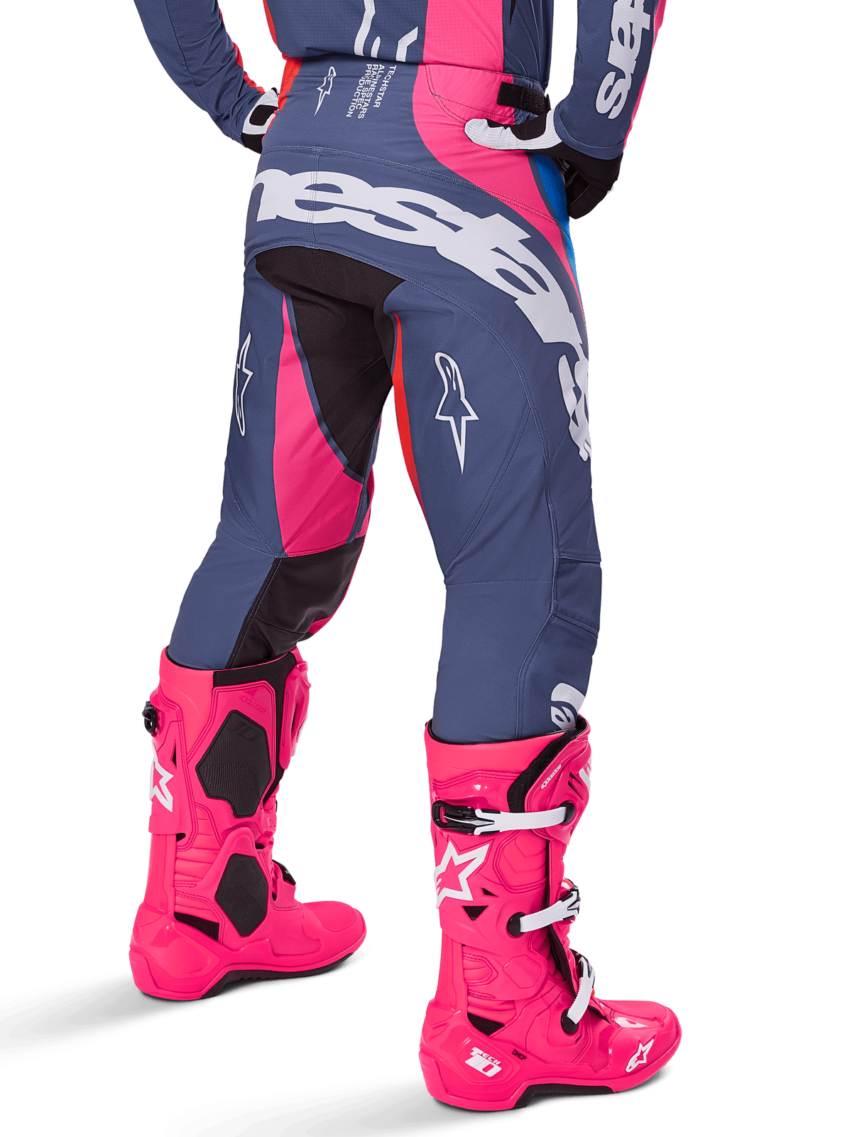 Alpinestars 2025 Techstar Dreem Pants, Motocross Pants, Gray and Bright Pink, worn with matching pink boots, featuring large white Alpinestars branding on the seat and star logos on the legs, durable athletic race fit for off-road performance