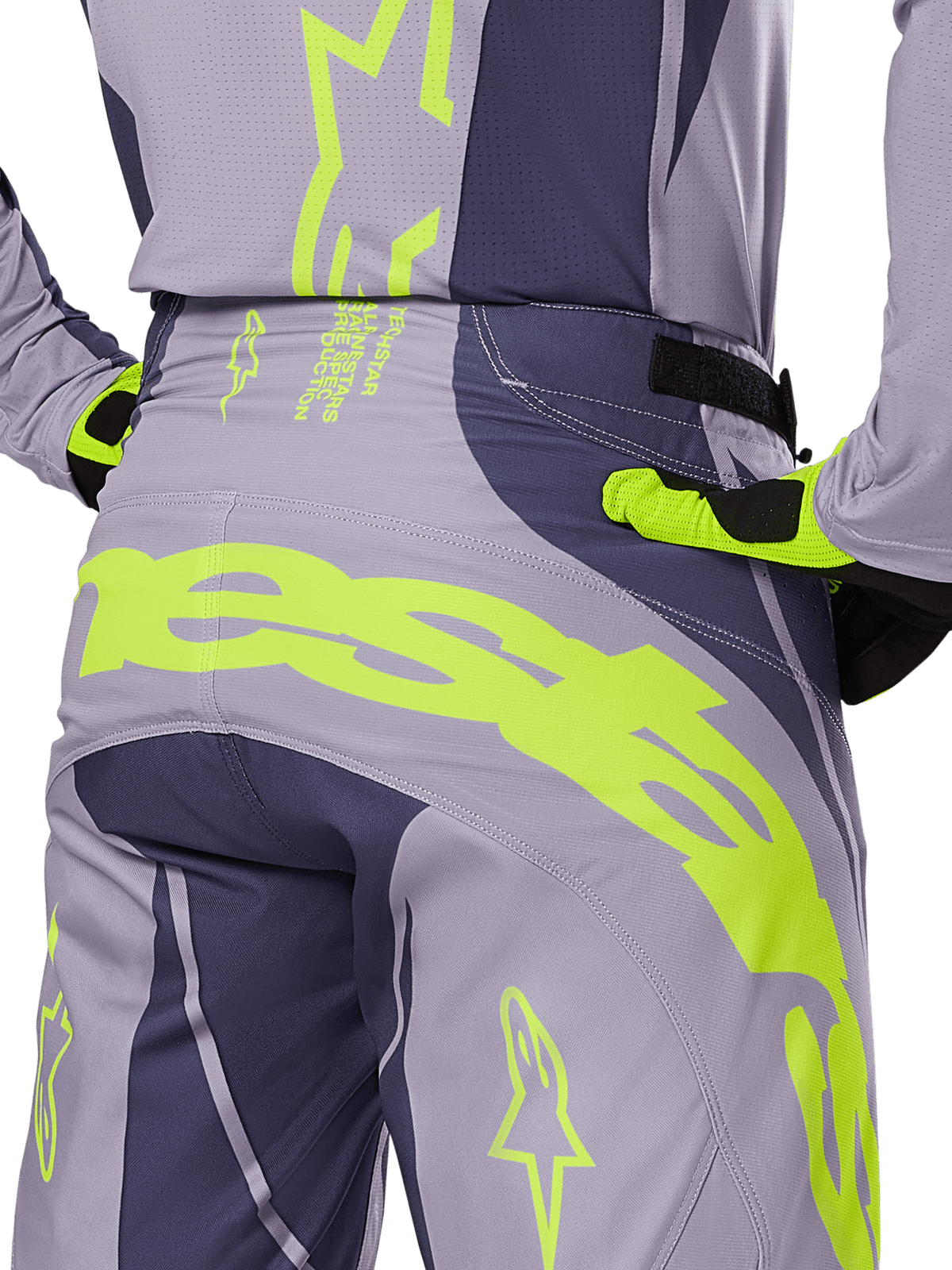 Alpinestars 2025 Techstar Dreem Pants, Motocross Pants, Gray and Dark Gray with bright Lime Green accents, rear detail view showing matching jersey and gloves, large fluorescent yellow branding across the seat, athletic race fit for off-road riding