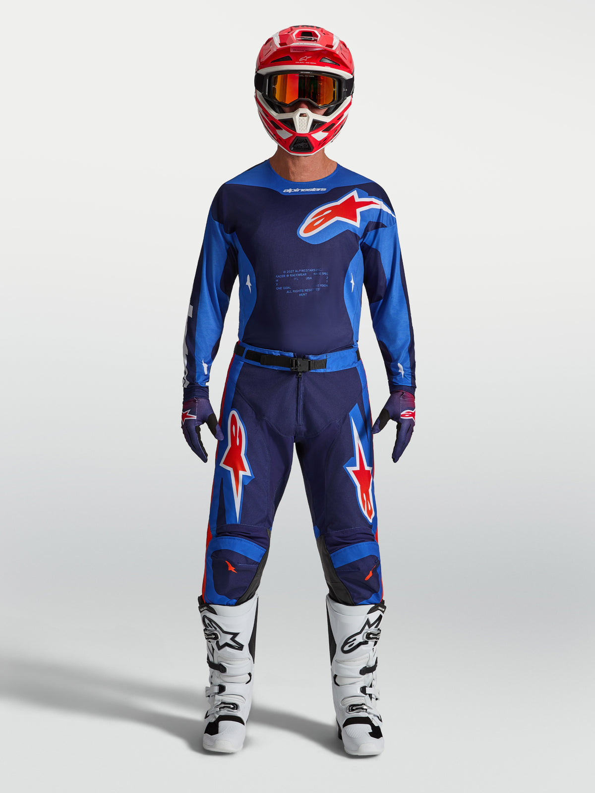 Pantalon Racer Hunt Alpinestars, pantalon de motocross bleu et rouge pour homme, en poly-tissu durable et extensible.