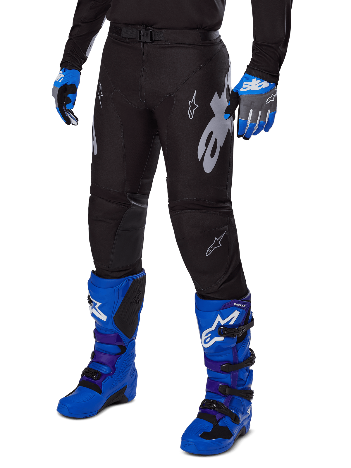 Alpinestars 2025 Racer Graphite Pants, Black Motocross Pants with white and gray graphics, worn with bright blue motocross boots and matching blue gloves, durable performance fabric for off-road riding