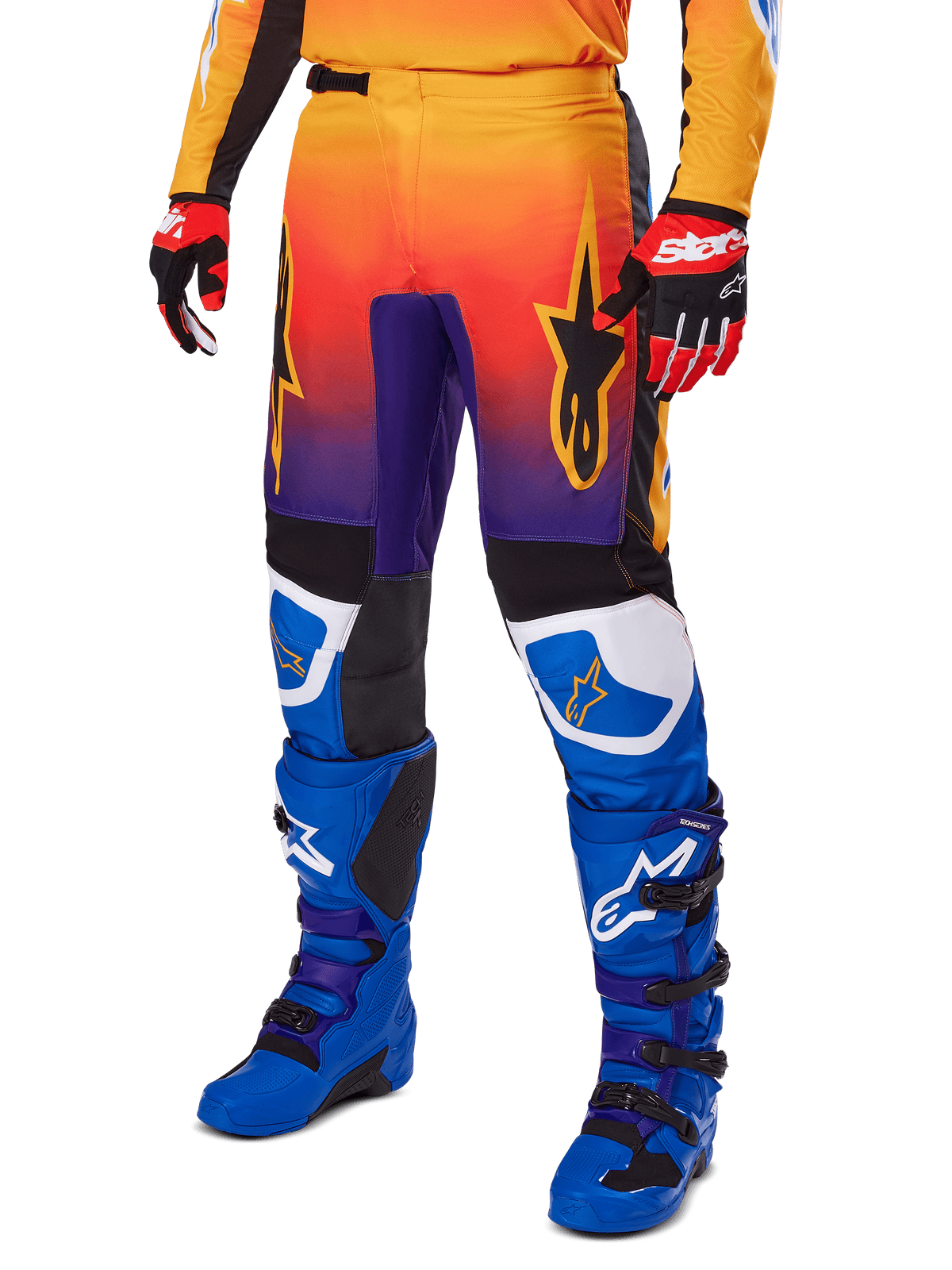 Alpinestars 2025 Fluid Wurx Pants, Motocross Pants, Multicolor orange red and purple gradient with black and blue panels, worn with blue boots and red gloves, featuring star logo graphics and white knee accents, durable performance gear for off-road racing