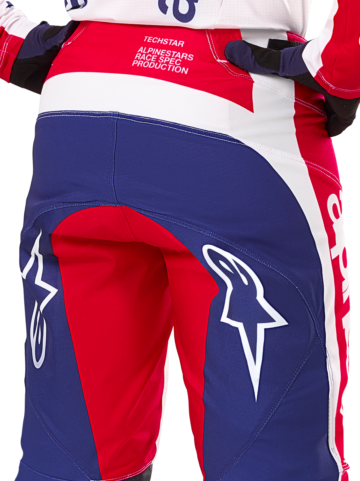 Alpinestars Limited Edition Techstar Fortitude Pants, Motocross Pants, Red White and Blue, Rear view featuring large white star logos on the seat and Techstar Race Spec branding, durable performance textiles for off-road racing