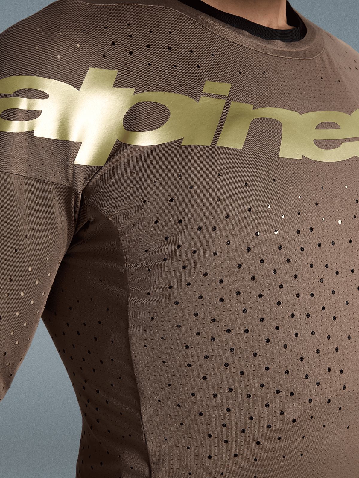 Maillot Alpinestars Supertech Air Gold Édition Limitée, maillot de motocross pour homme, marron et doré, avec perforations laser et logo Alpinestars sur la poitrine