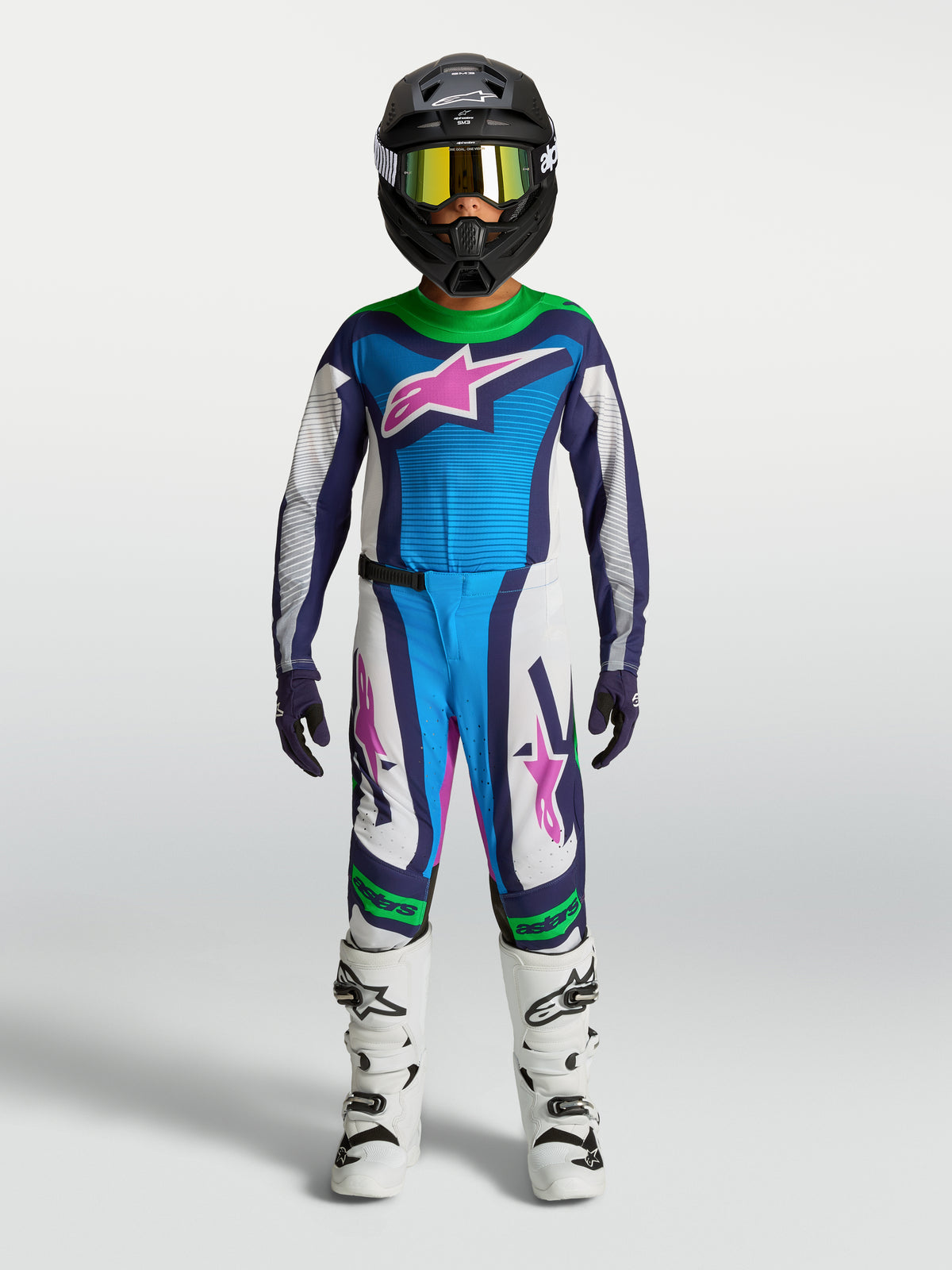 Tenue Alpinestars Supertech Maven Junior, pantalon et maillot de motocross bleus et blancs avec vert fluo, coupe athlétique.