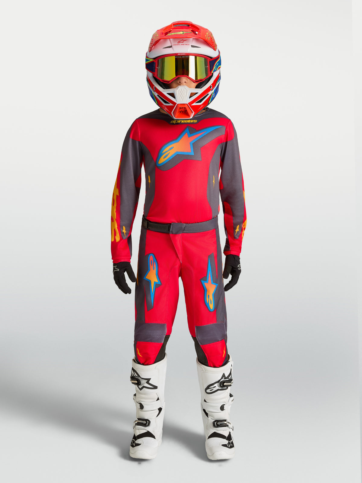 Pantalons Fluid Hunt Junior Alpinestars, équipement de motocross rouge et gris pour enfant, coupe sport durable.