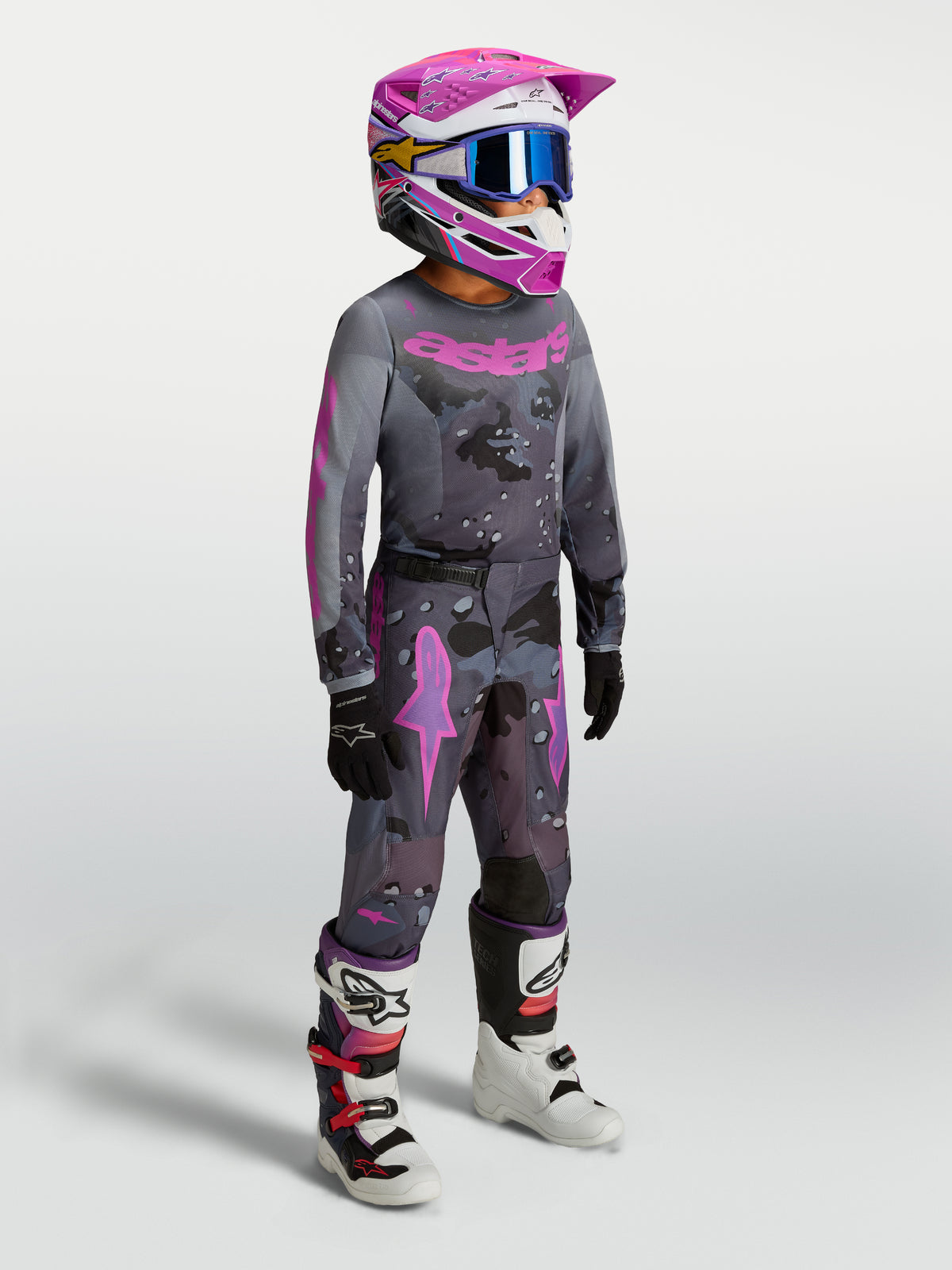 Alpinestars 2027 Youth Fluid Lone Gear Set, gray and pink motocross outfit with matching jersey, pants, and helmet.