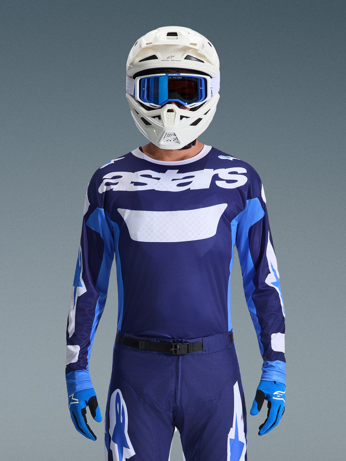 Alpinestars 2026 Racer Riway Gear Set, Motocross Jersey and Pants, Navy and Royal Blue with White accents, featuring 'astars' branding, worn with a white helmet, blue goggles, and blue gloves, athletic fit for off-road performance